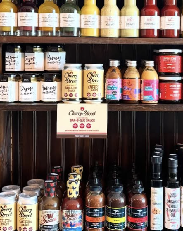 Cherry St BBQ Sauce display on retail shelf