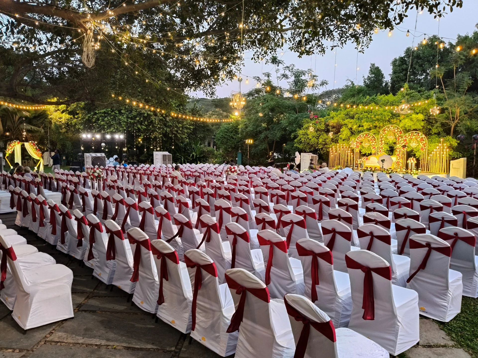 Ficus Lawn large open wedding lawn with floral mandap setup at SPP Gardens Chennai