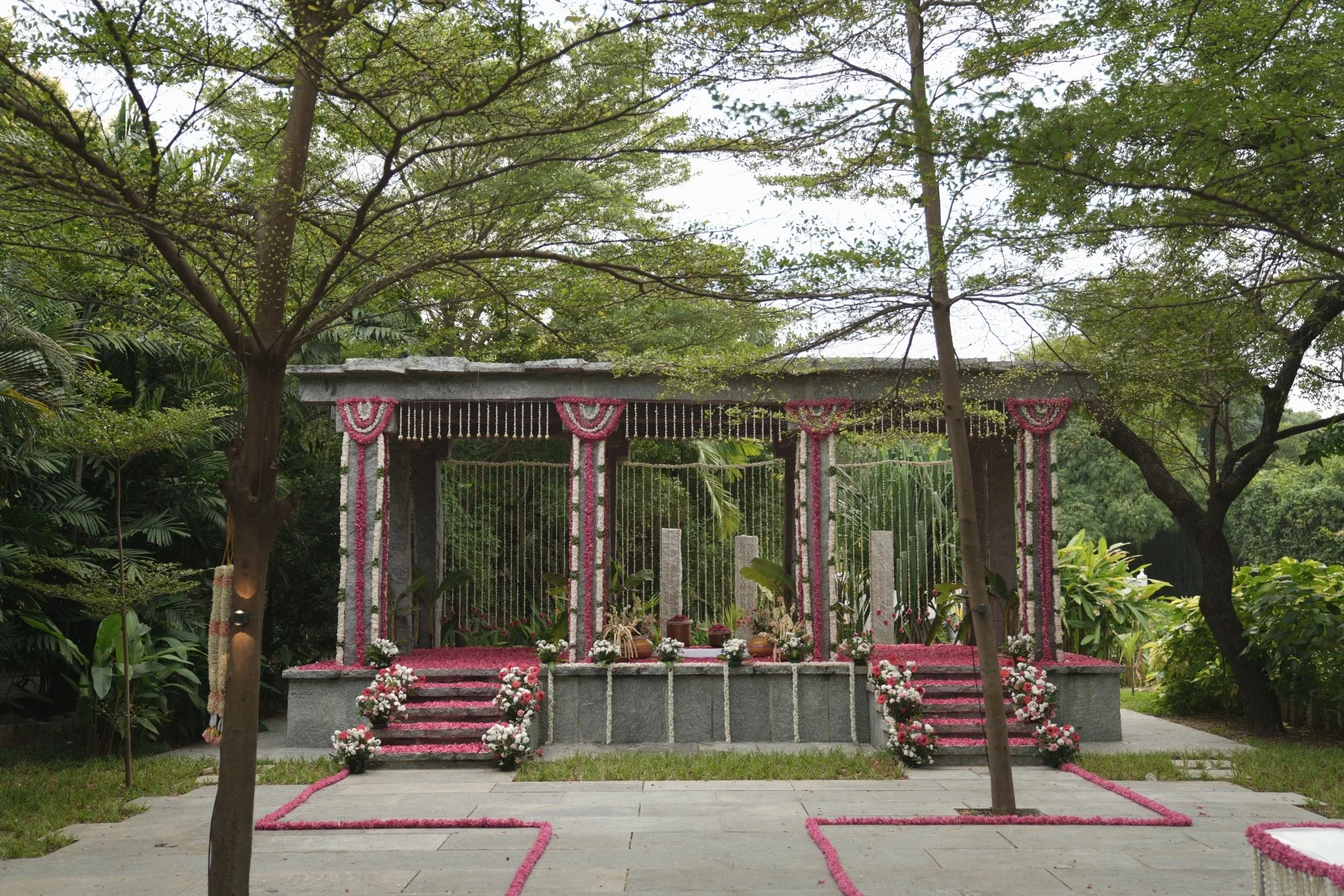 Private outdoor wedding venue at Raghava Mandapam SPP Gardens Chennai with granite mandap and garden setting