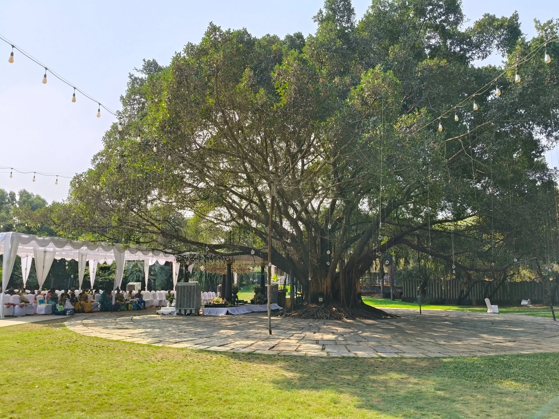 Ficus Lawn outdoor private event setup at SPP Gardens Chennai with open green lawn and trees
