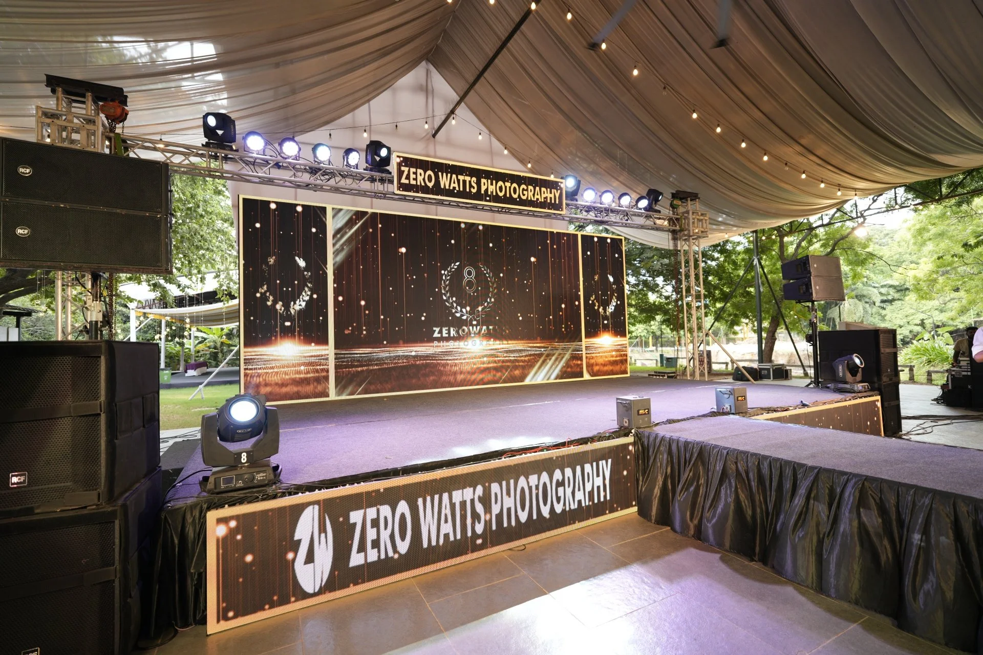 Outdoor corporate event venue at SPP Gardens Chennai with open lawn and pavilion setup