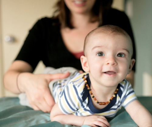 Craniosacral therapist working with a toddler during a calm session