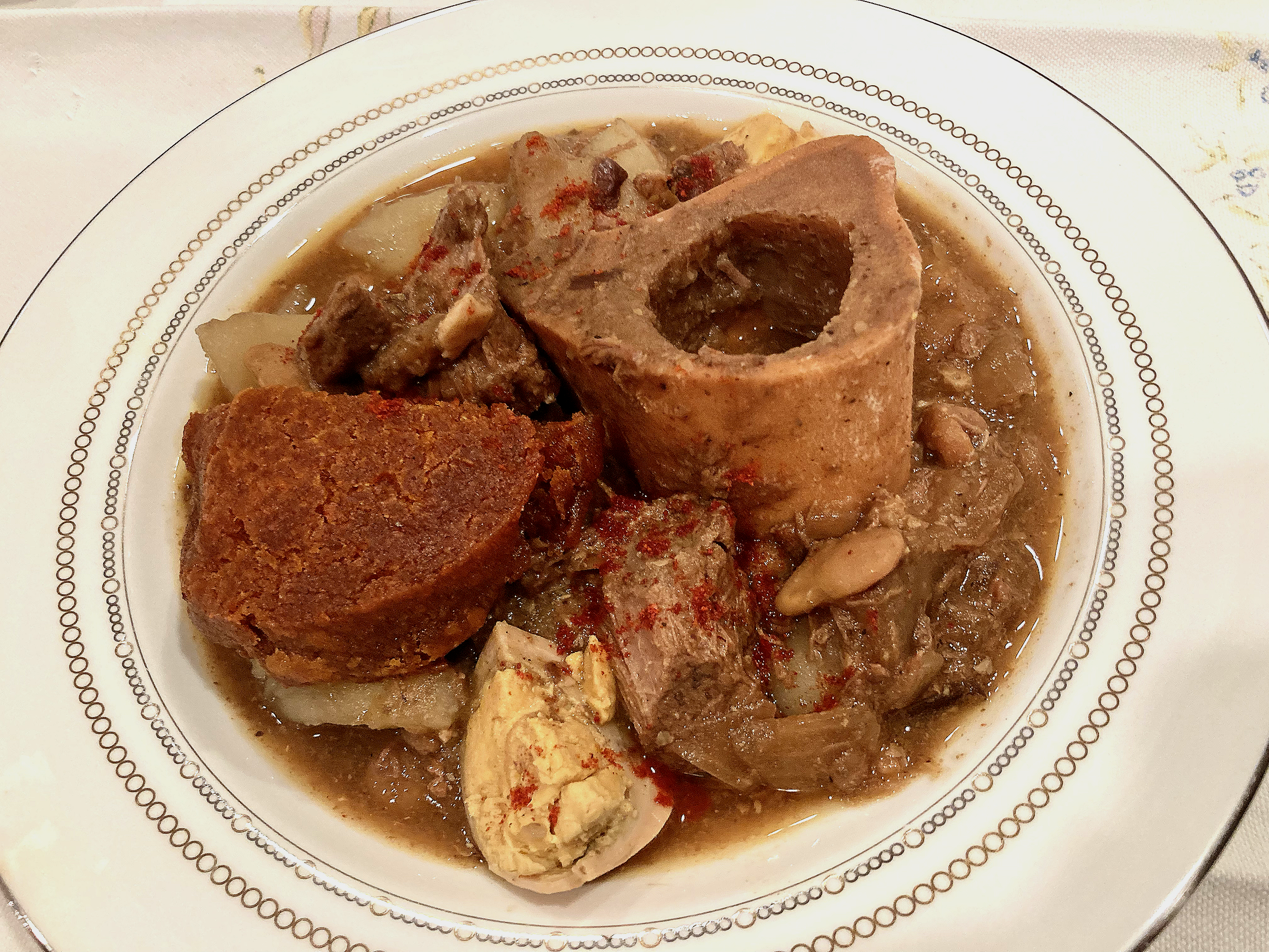 cholent served with marrow and kishke