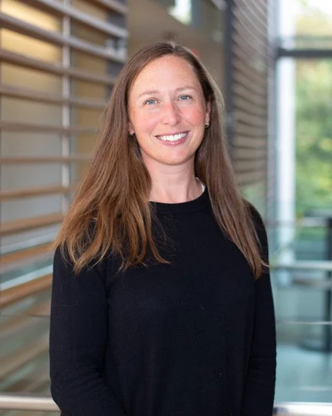 A white woman with long brown hair 