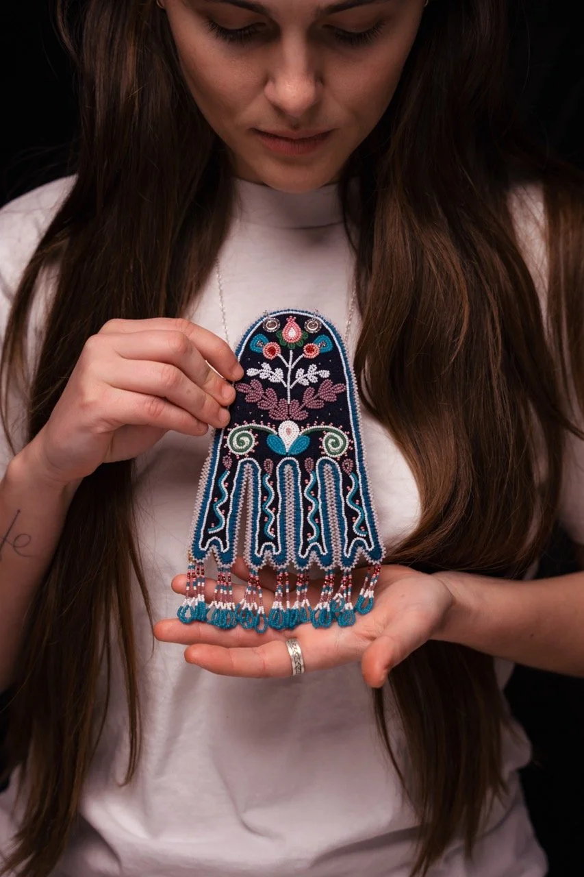 Image of artist holding a beaded Octopus Bag