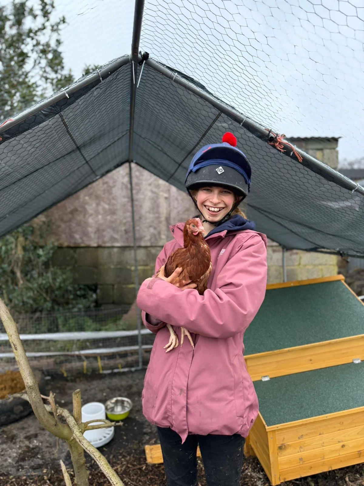 Apprentice, and Chief Chicken Officer, Emily with her assistant, Lara
