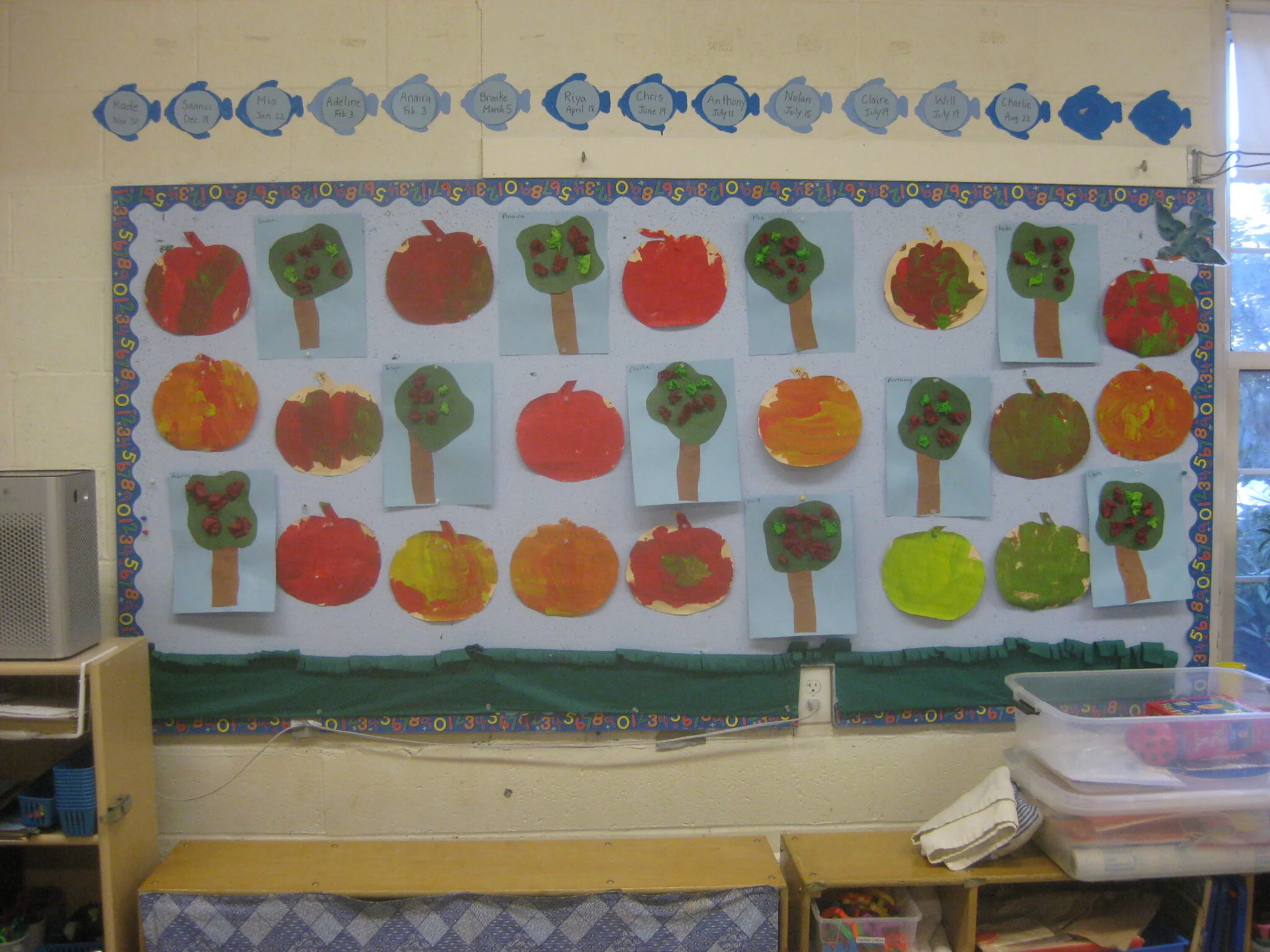 Scrunched tissue paper apple trees along with painted apples.
