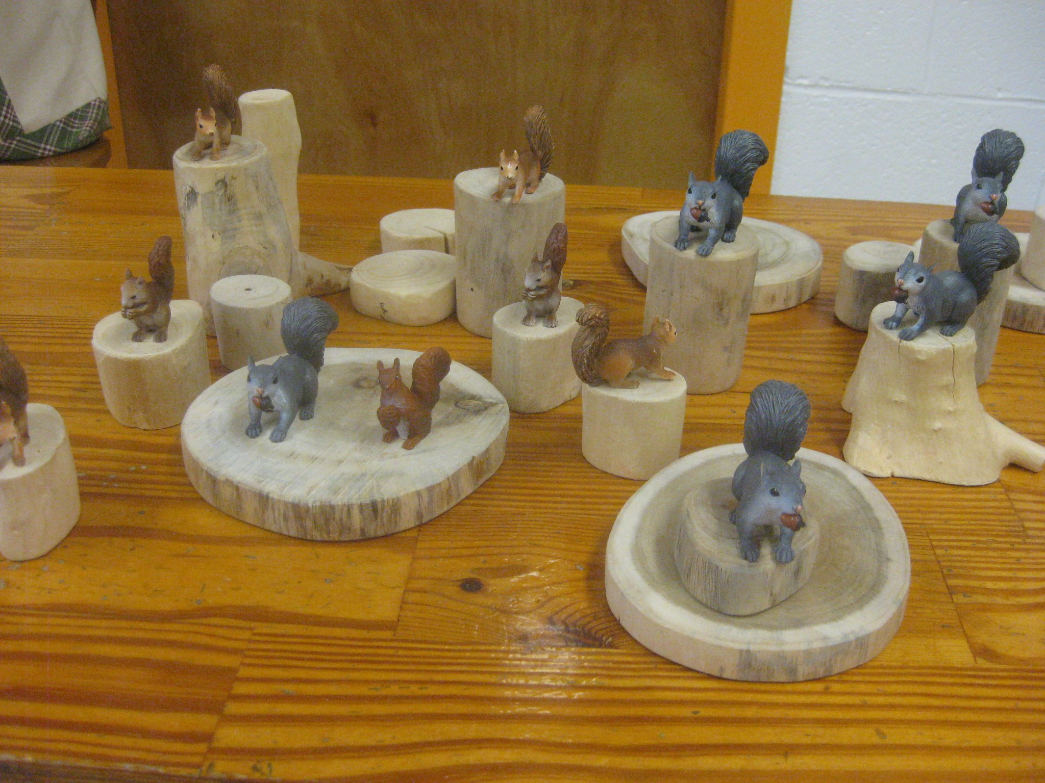 Squirrels climbing on the trees.