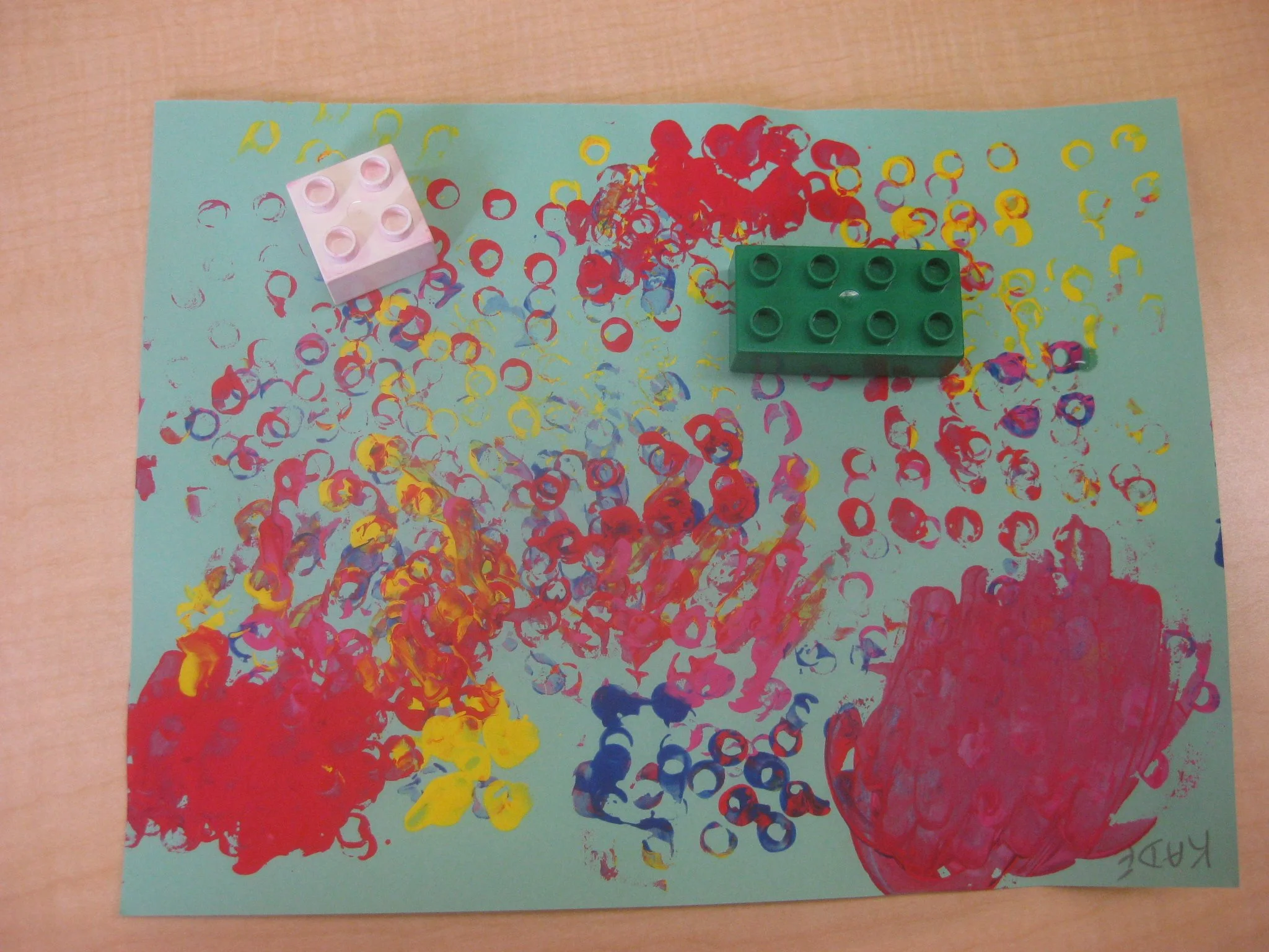 Painting with duplos.