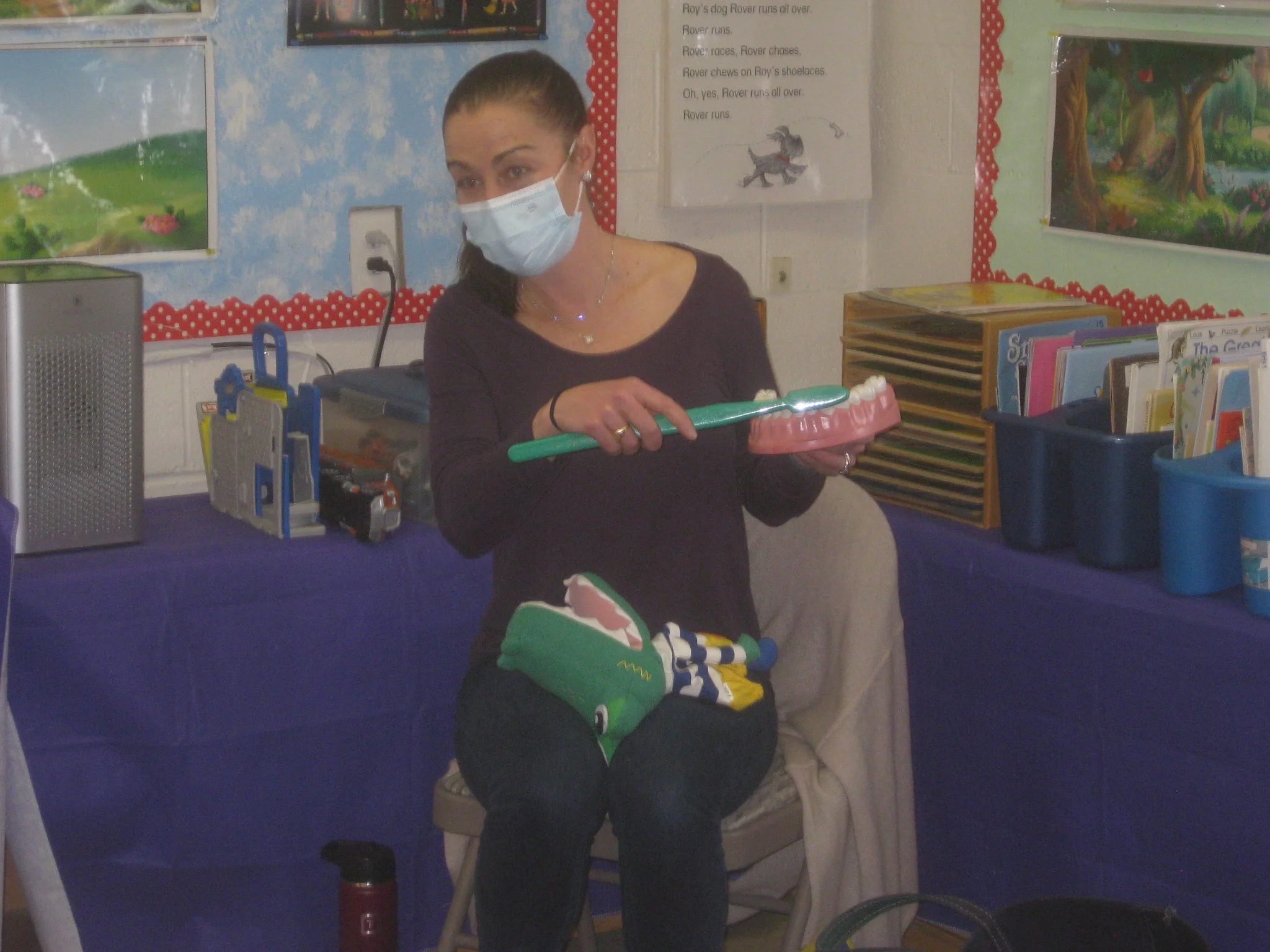 Dr. McCafferty showing how to brush teeth.