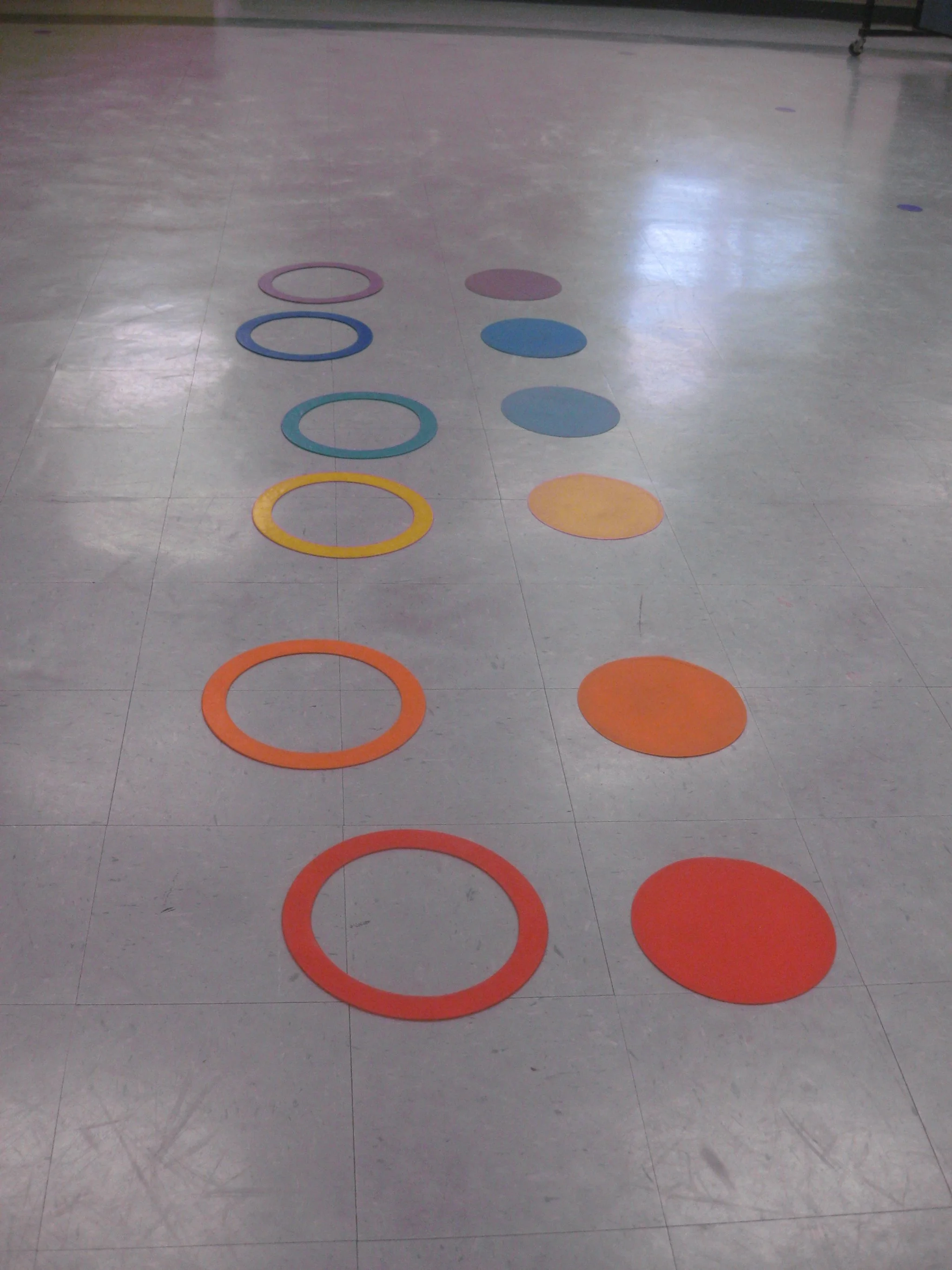 Mrs. Lyng placed the circles in a rainbow pattern in Movement Class.