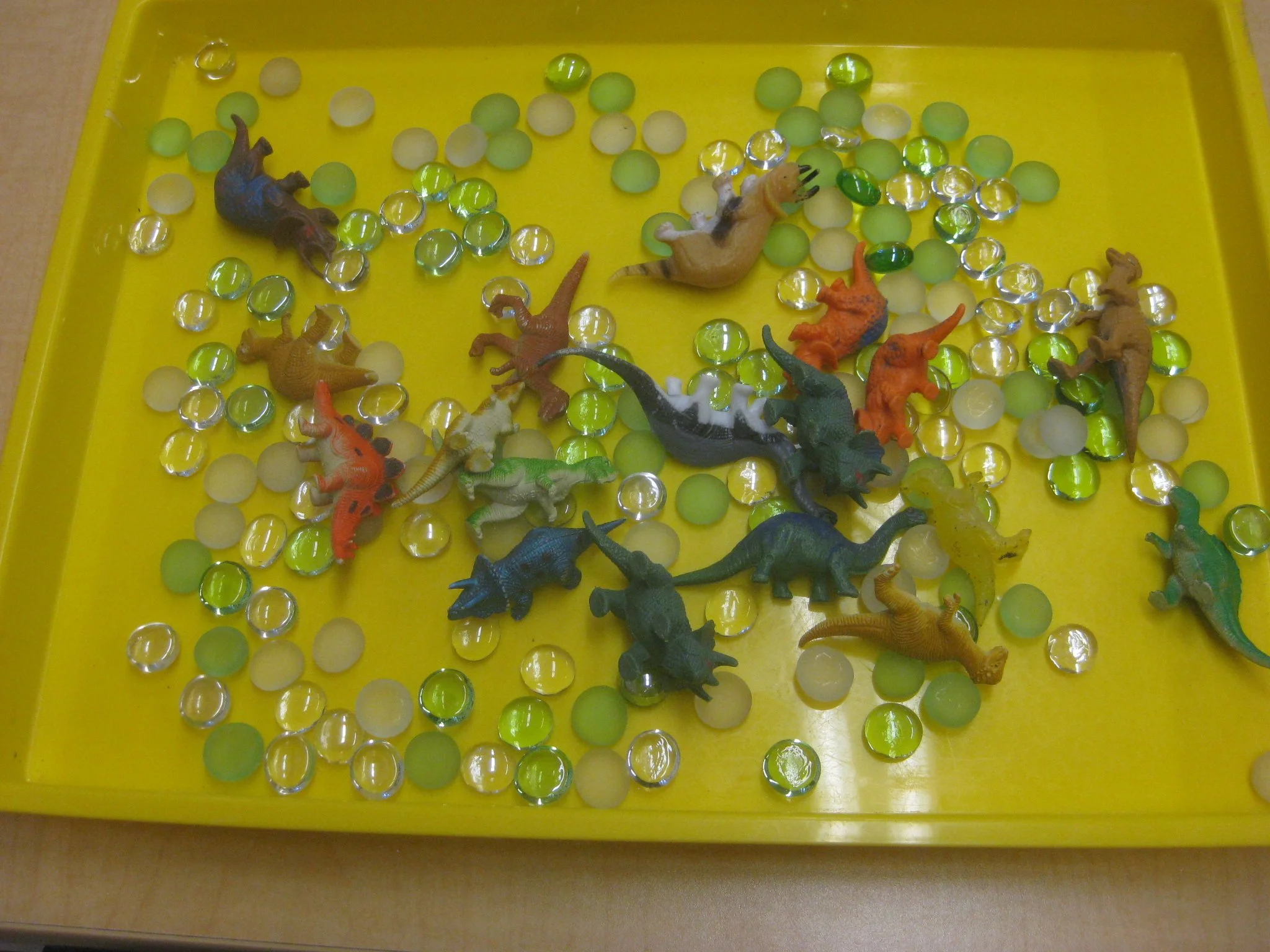 Dinosaurs and glass stones.