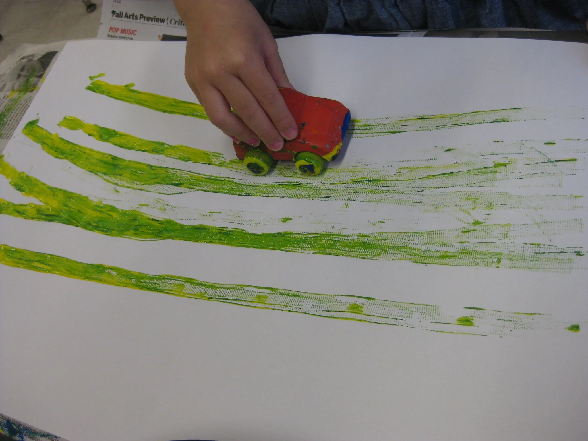 Crossing the midline by painting with cars.