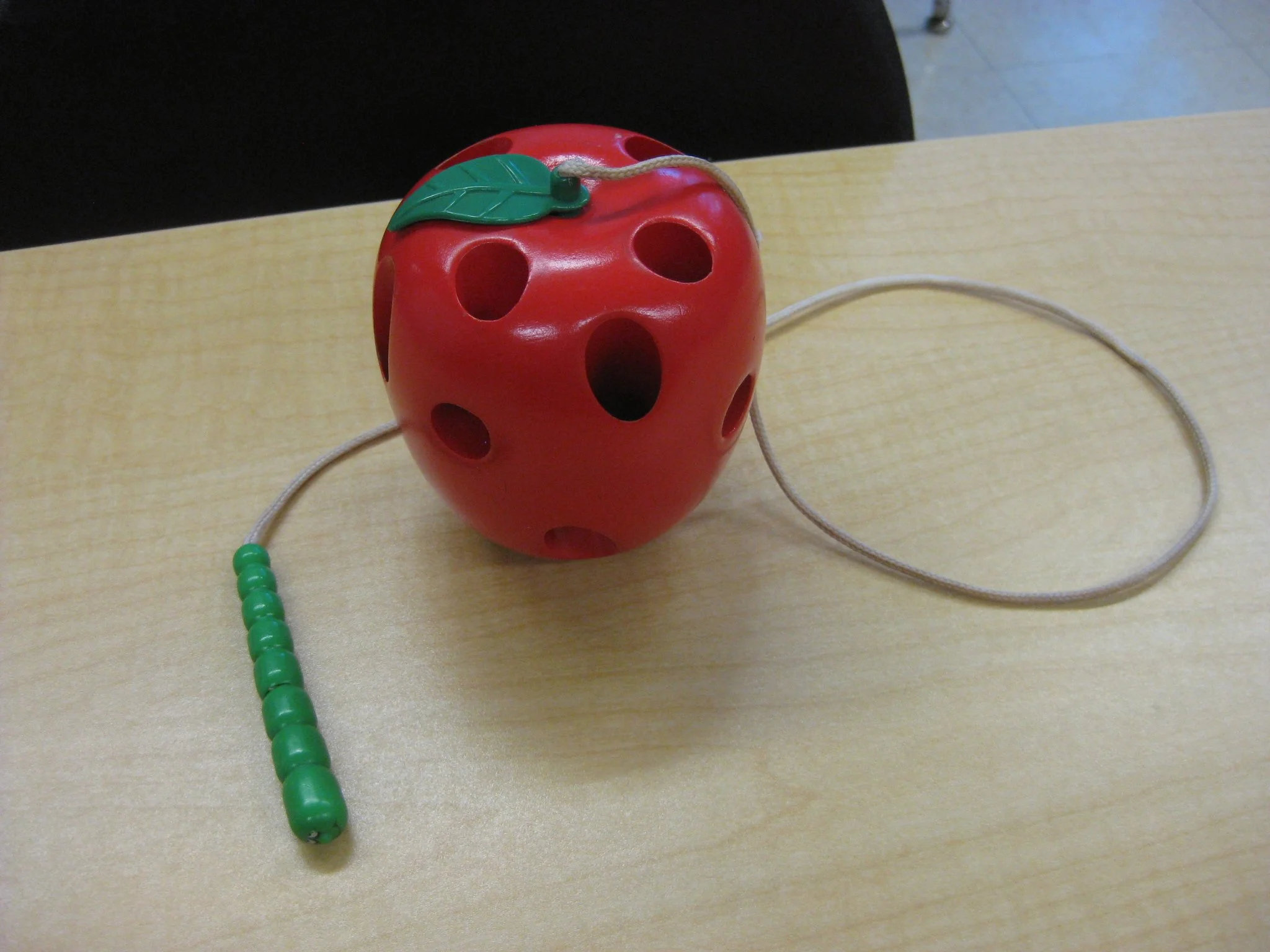 Apple with hungry worm