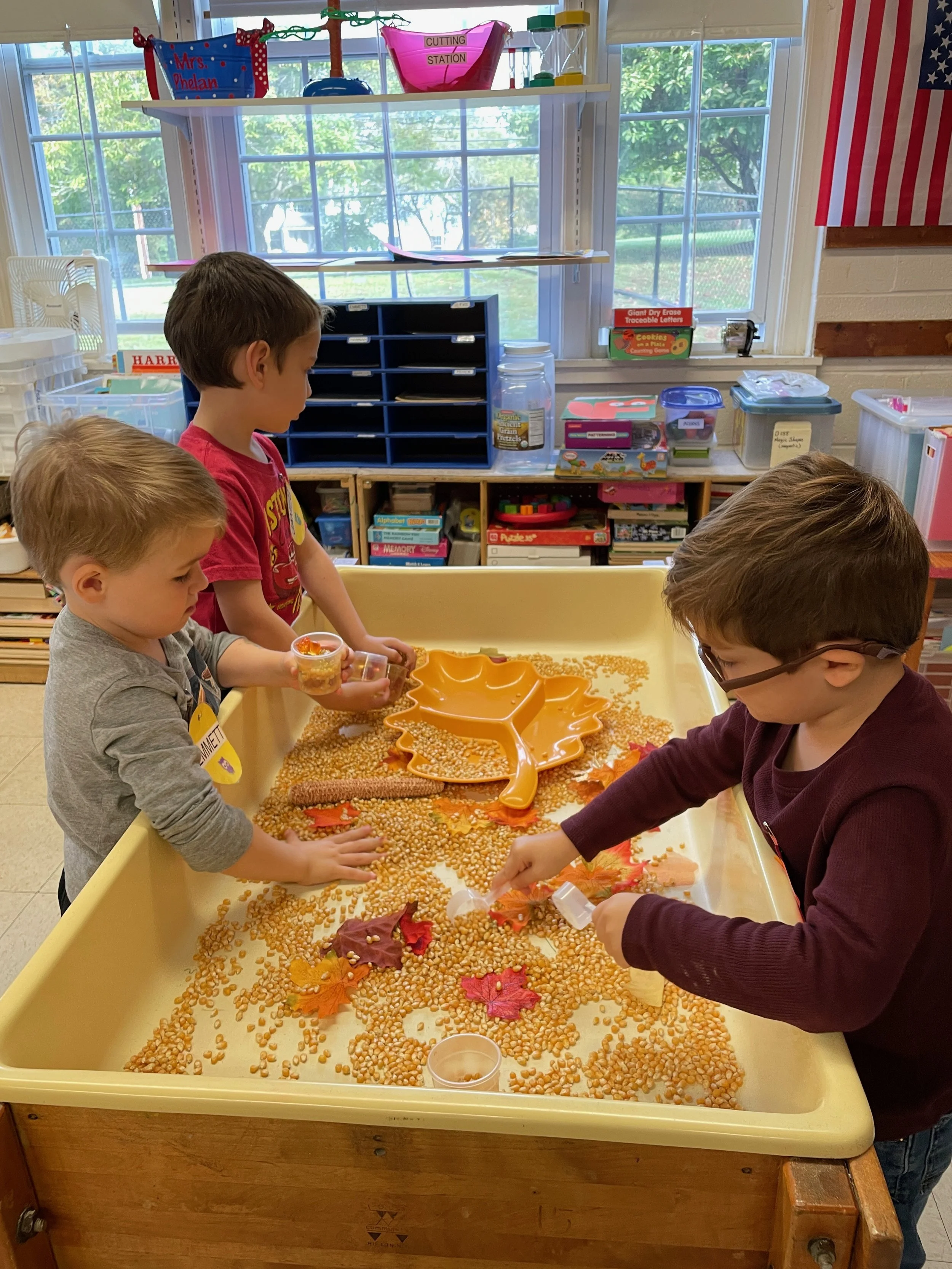 exploring corn in sensory table