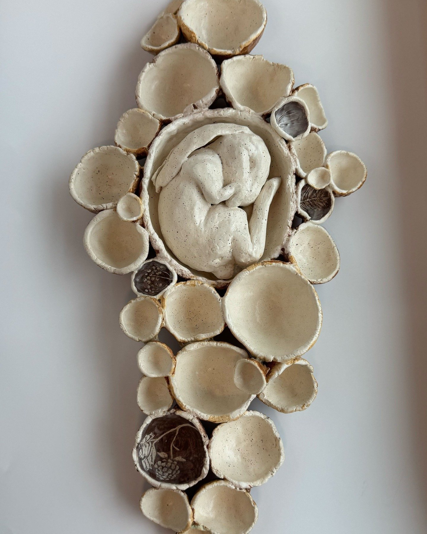 "Hibernation". A somatic sculpture, capturing the desire to curl up and rest during the long, long winter. Man, did this winter ever call for hibernation. 

This piece is designed so that you can tuck your own treasures into the warren: see