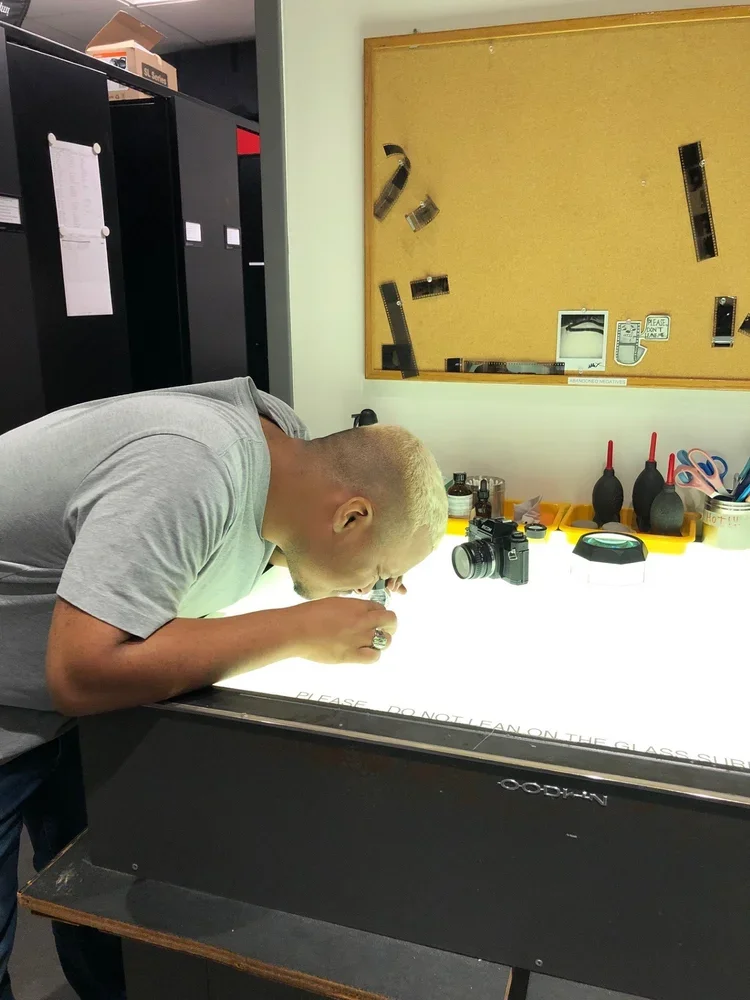 Photography Student checking photo negatives