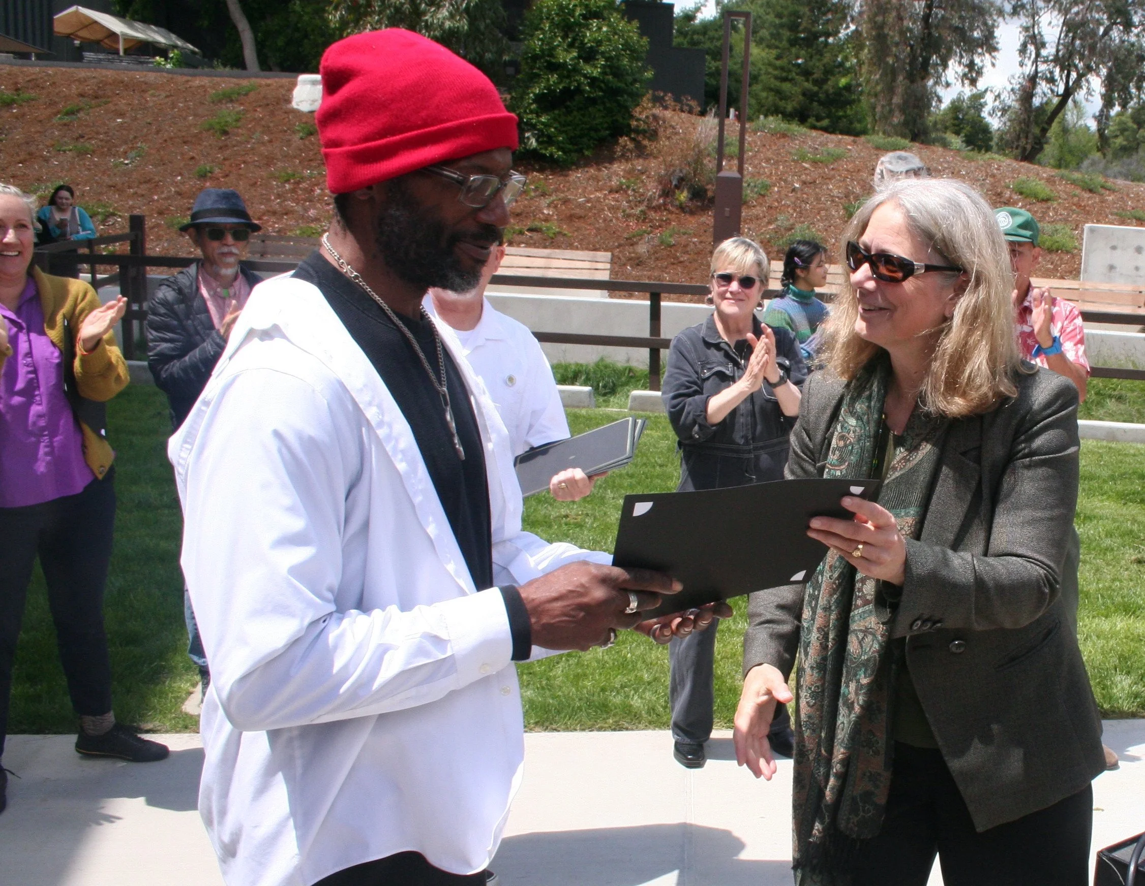 Diablo valley college president, Susan Lamb handing out an award to Student, Horace Cage