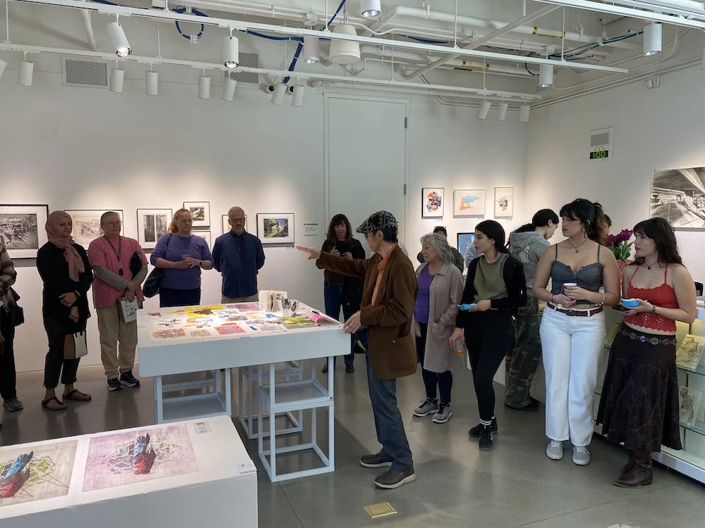 Toru Sugita speaking to visitors at reception