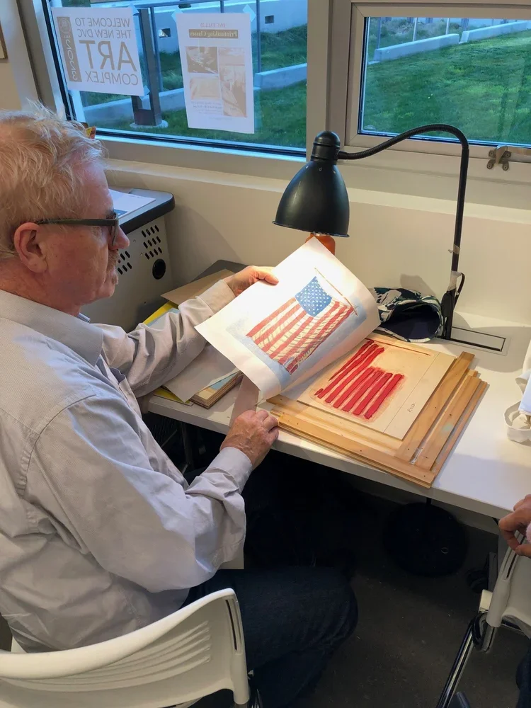 Printmaking Student showing an example of a print made with watercolors