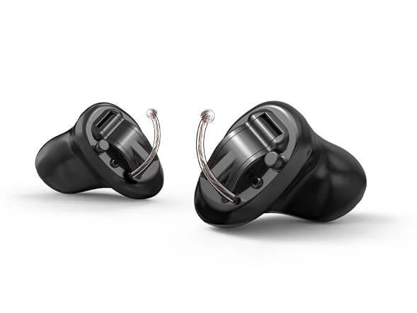 Pair of discreet custom-fit in-ear hearing aids designed for comfort and near-invisible wear