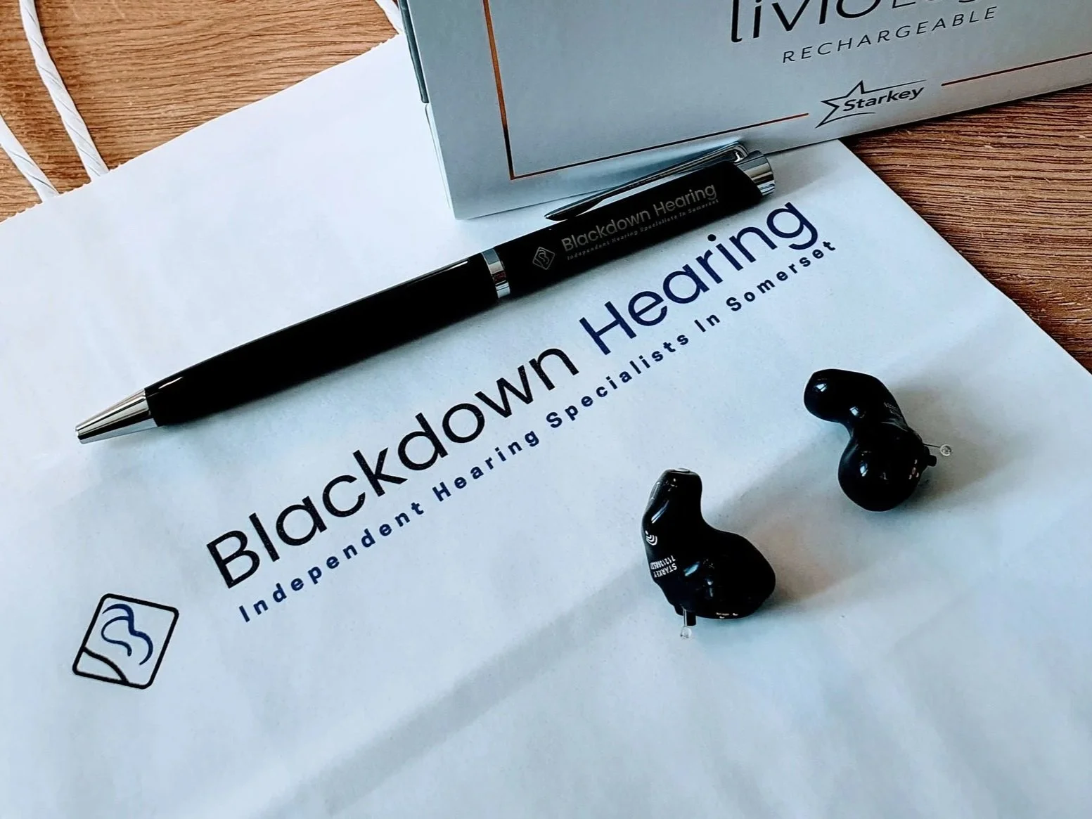 Photo of Blackdown Hearing hearing aids and presentation bag
