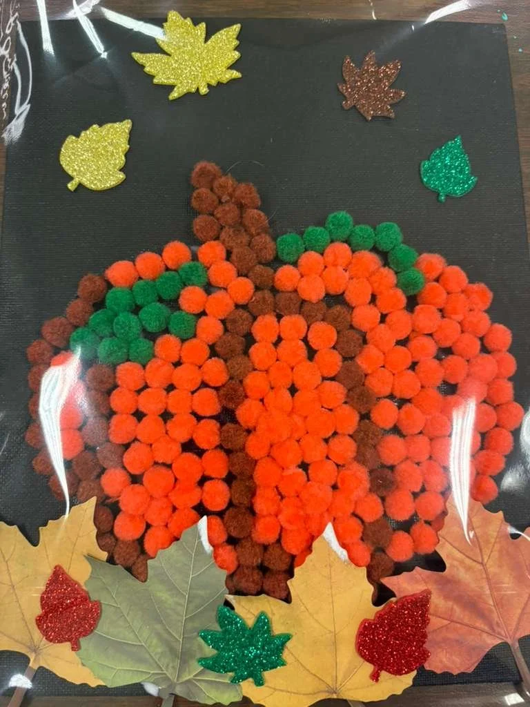 pumpkin pom pom art work ceramics on wheels.jpg