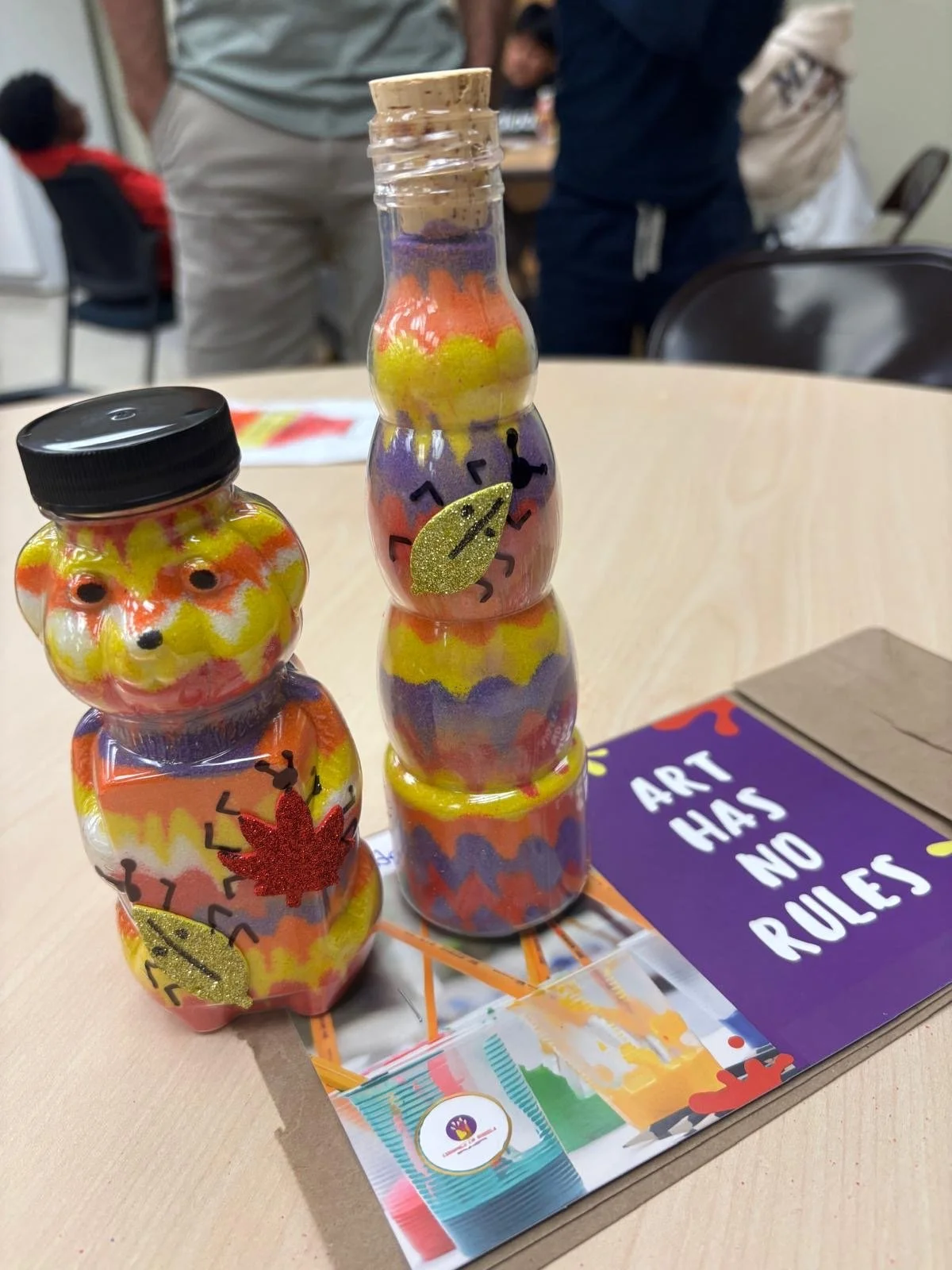 sand bottle art in a bear bottle and long bottle.JPG