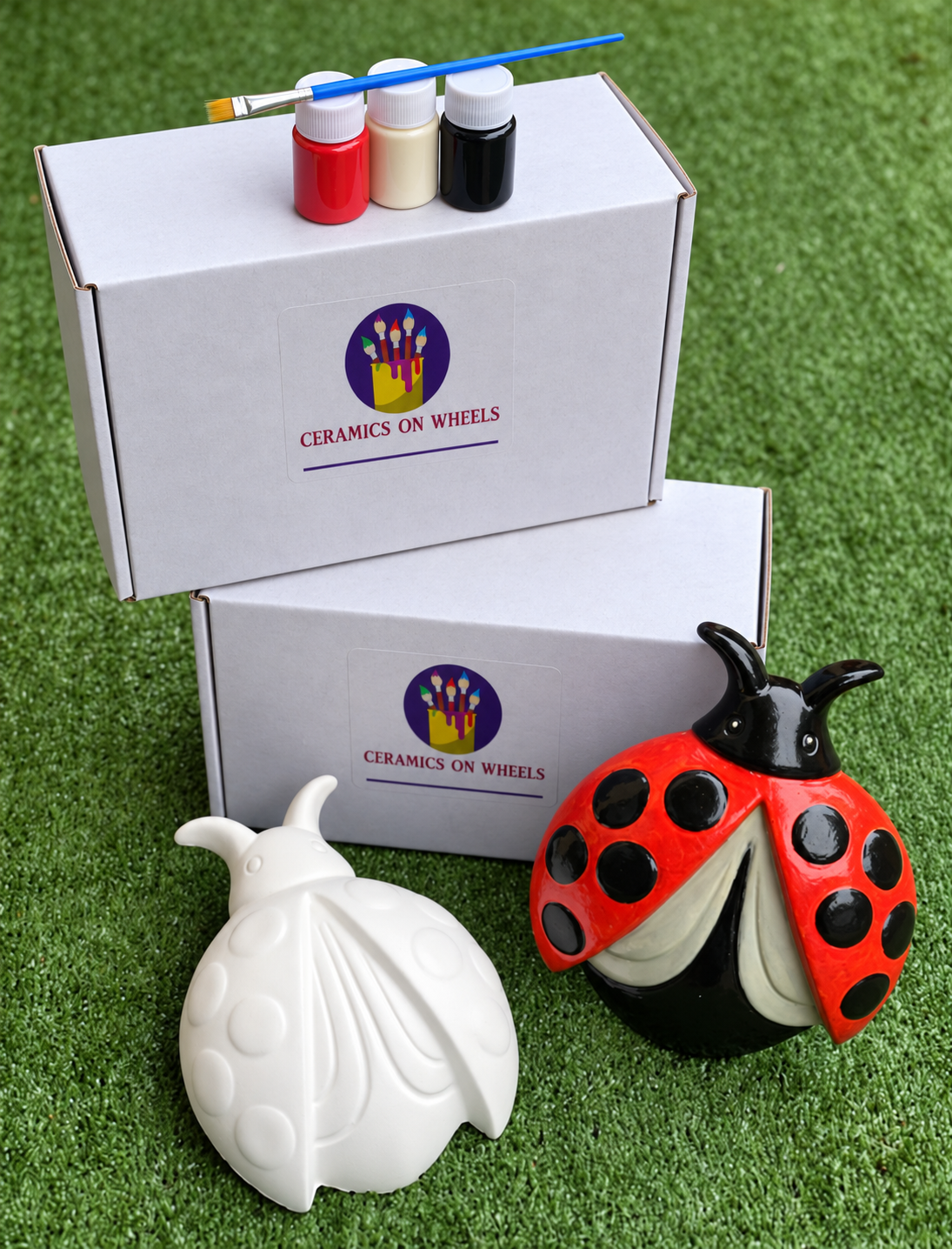 White Ceramics on Wheels with Ladybugs.png