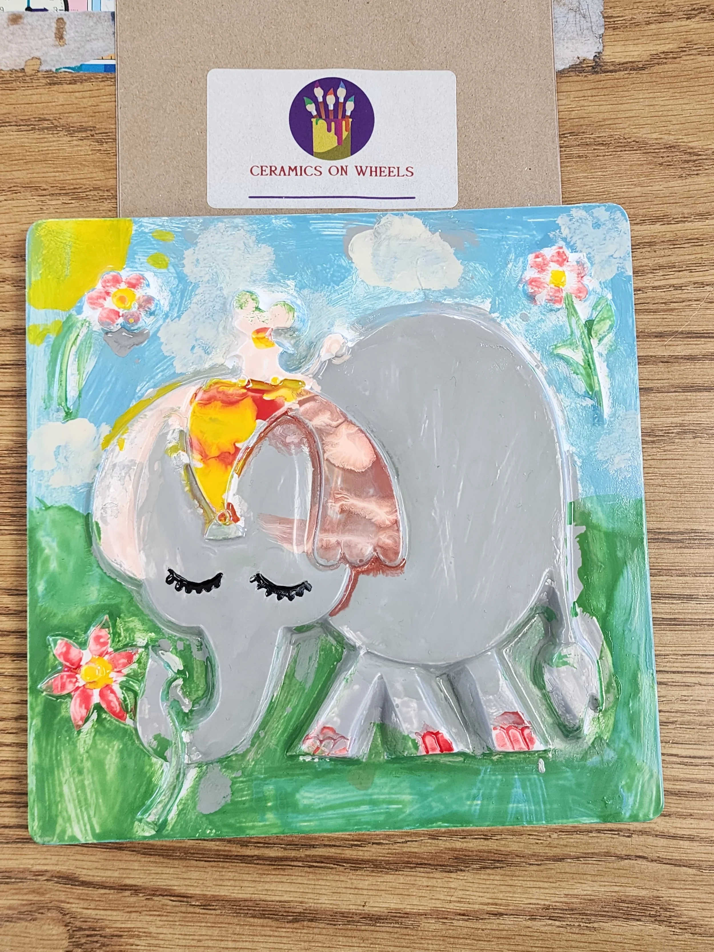 NEWscenic elephant holding flower cermaic painting.JPG