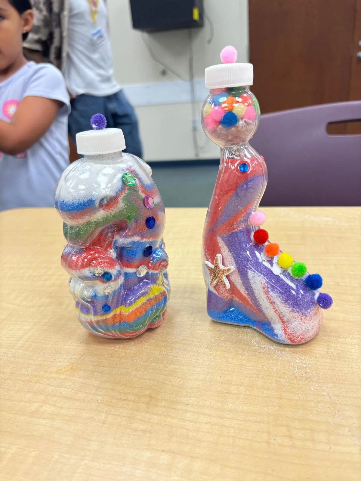dolphin and seal sand art bottles.JPG