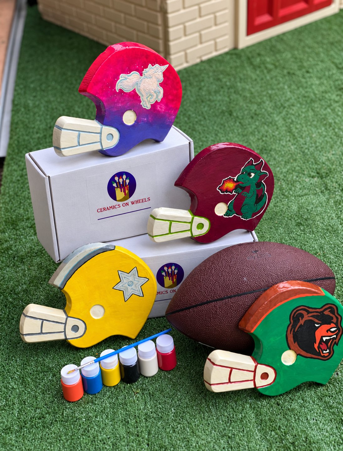 Hand-painted helmets on white boxes.png