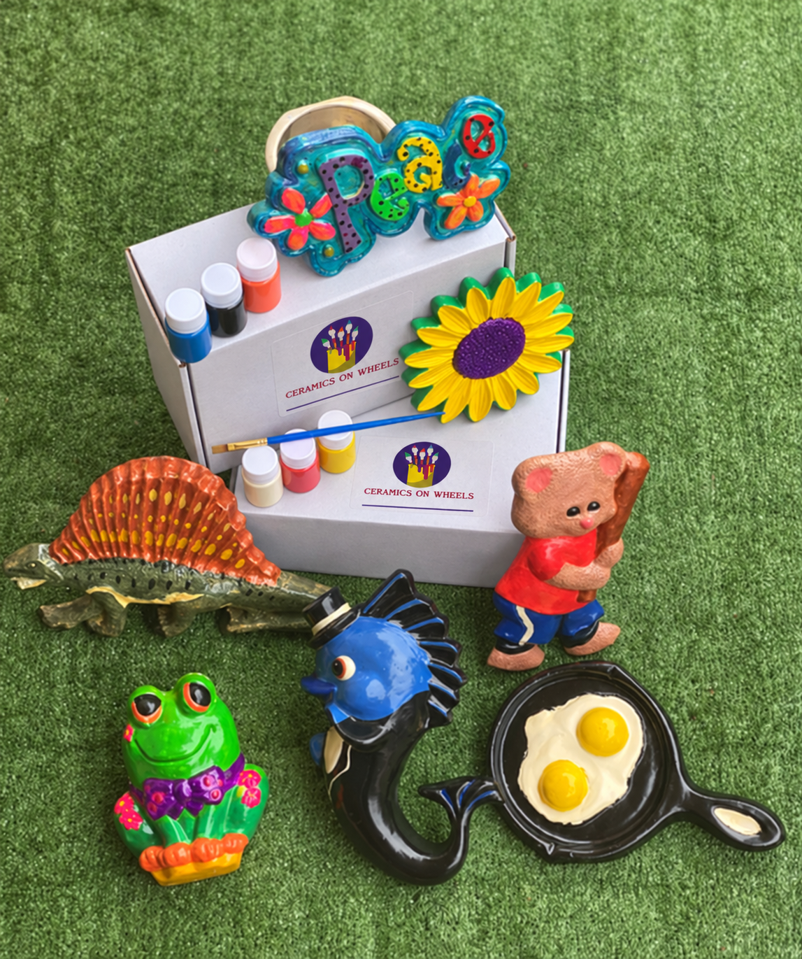 Colorful ceramics on branded white boxes.png
