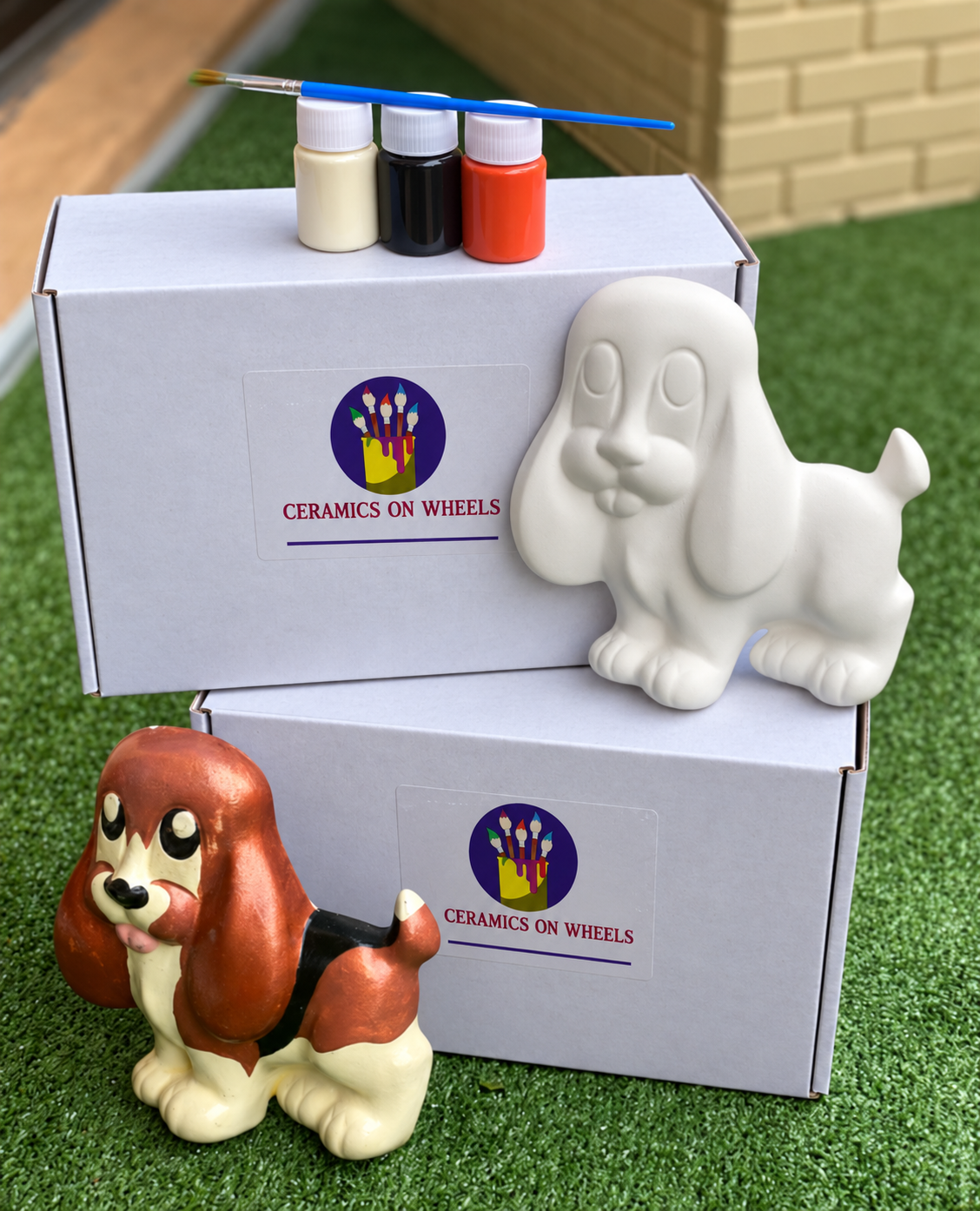 Ceramics on Wheels boxes and basset hounds.png