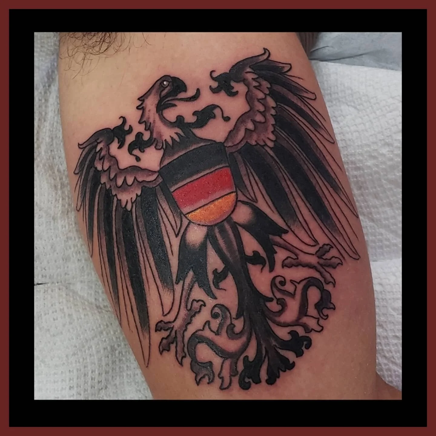 #germaneagletattoo on @a_lopez117 to represent time spent in parts of Europe including Germany. #eagletattoo #blackandgreytattoo #colortattoo #travelingtattoo #homewardboundtattoo #industryink