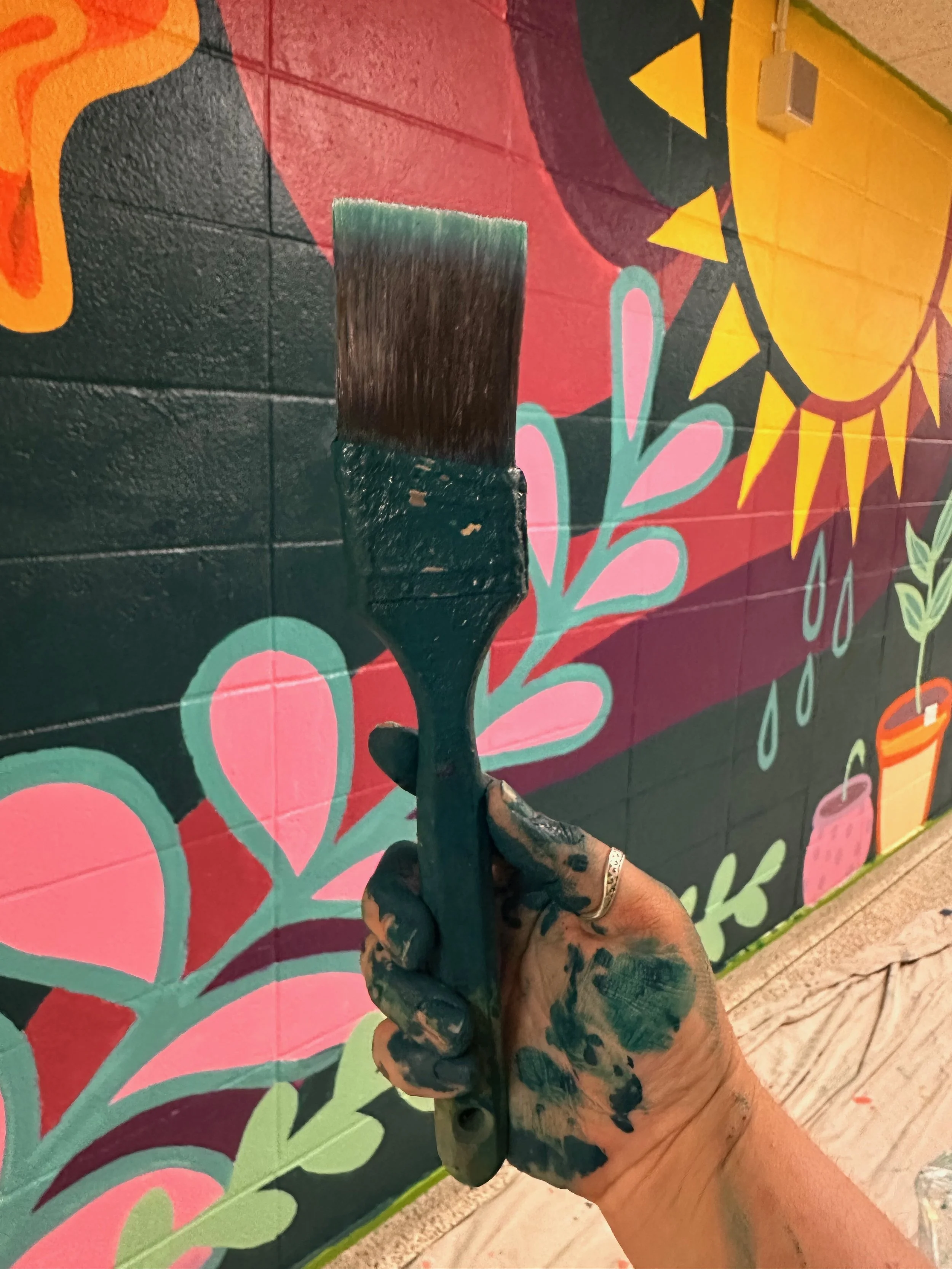 Hampton Bays High School: a celebration of growth in the life skills hallway. This collaborative installation was the result of a values exercise with high school artists.