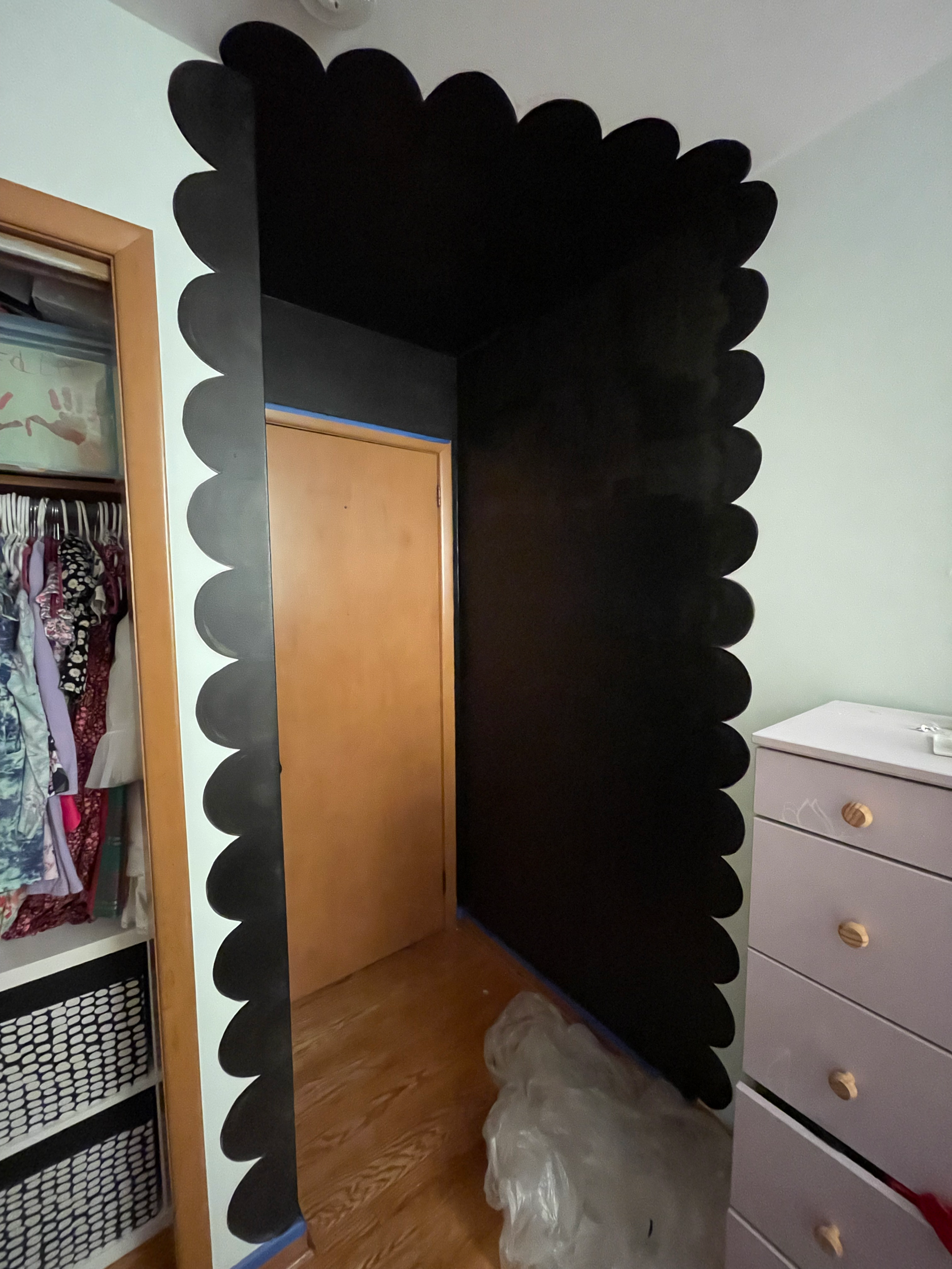 Scalloped Entry Progress Pic: this installation features black chalklboard paint and takes an otherwise awkward mini-hallway into a modest children's bedroom and creates drama and intentionality.