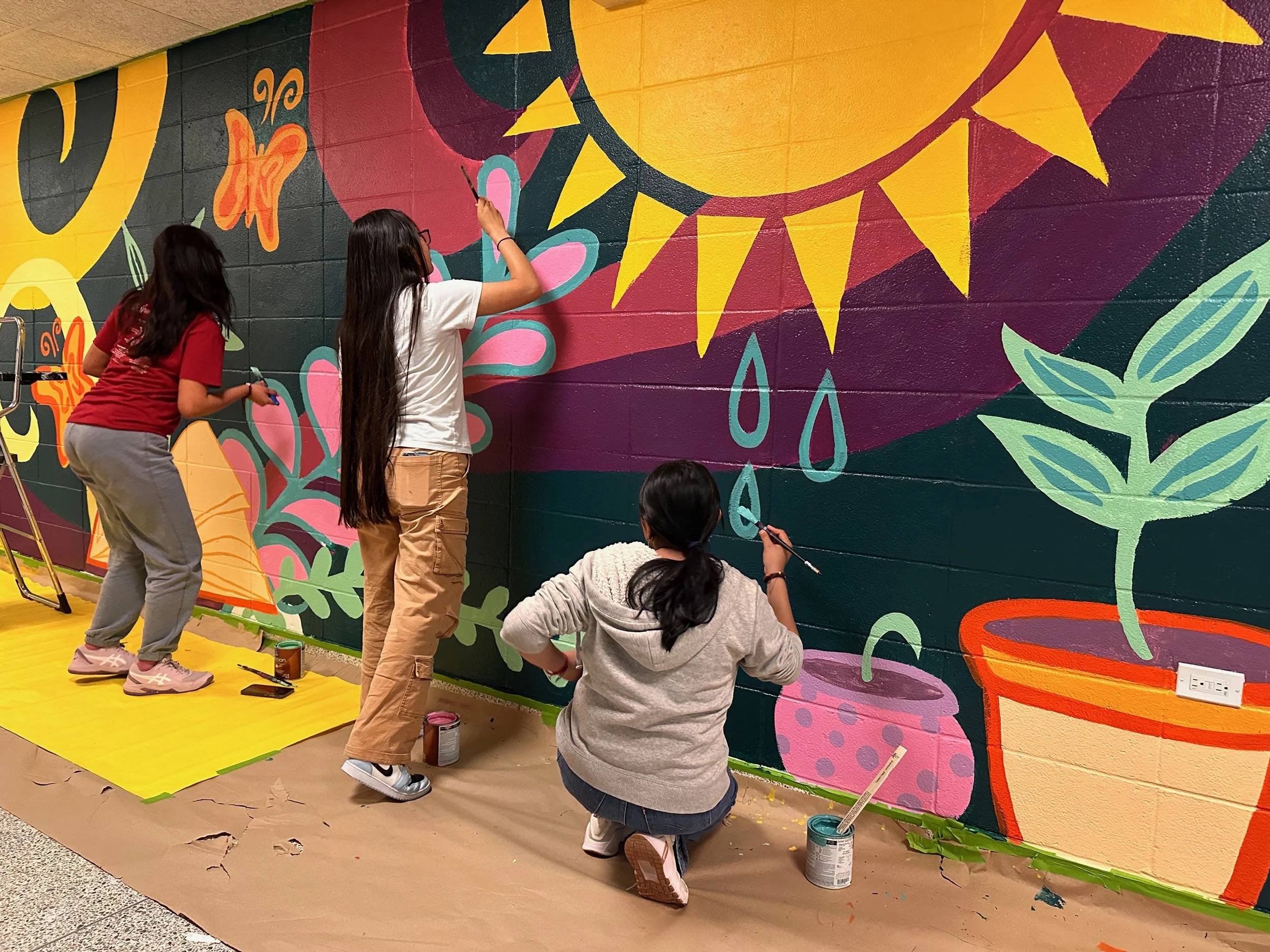 Hampton Bays High School: a celebration of growth in the life skills hallway. This collaborative installation was the result of a values exercise with high school artists.