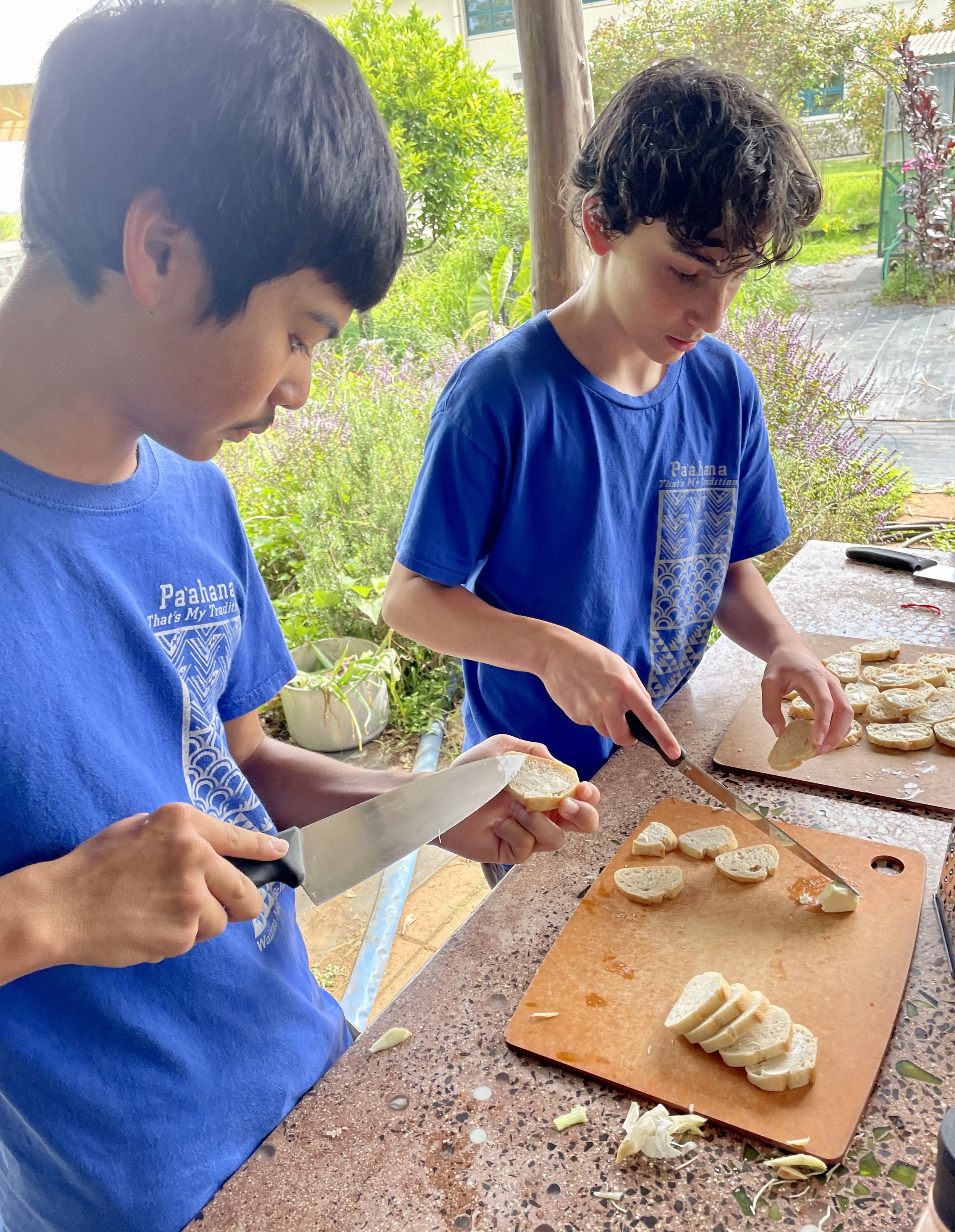 Keokolo and Henry Cutting Bread.jpg