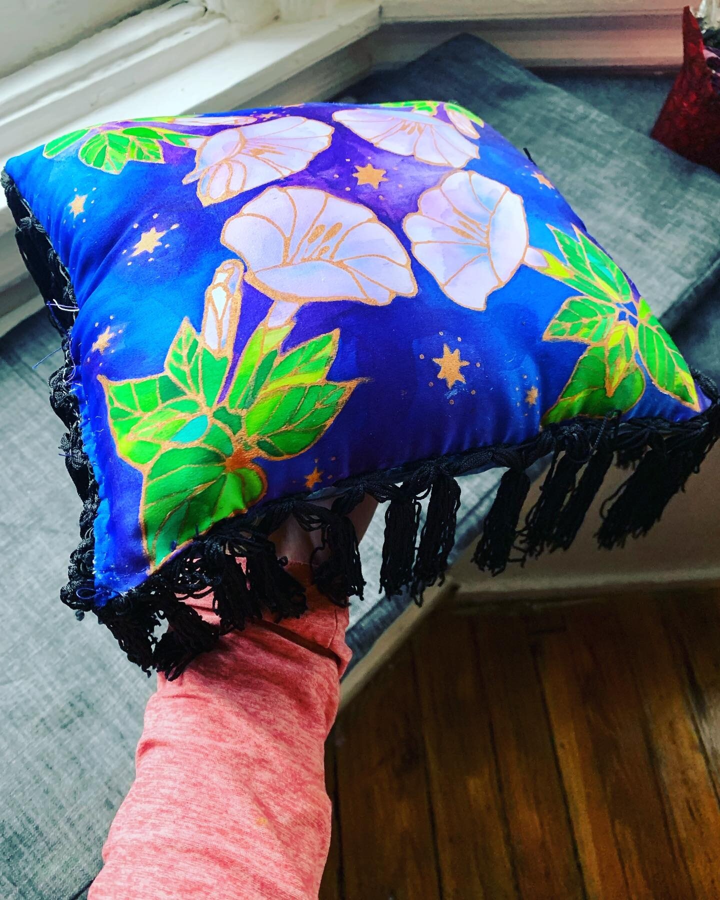 Datura painting transformed into a very tiny fancy pillow, silk painted charmeuse with gold lining on front, indigo dyed shibori on the back on 8mm silk, fringe detail