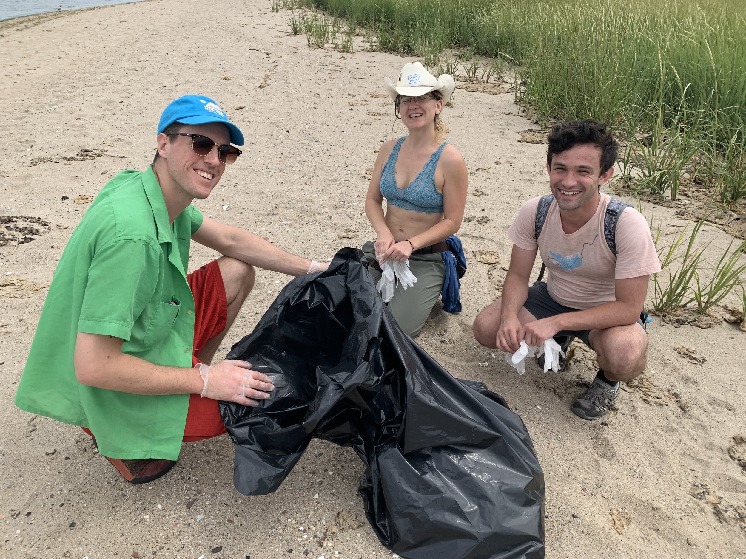 Jonah, Lauretta, and Bogdan clean the beach and find items to build their natural found object sculptures.