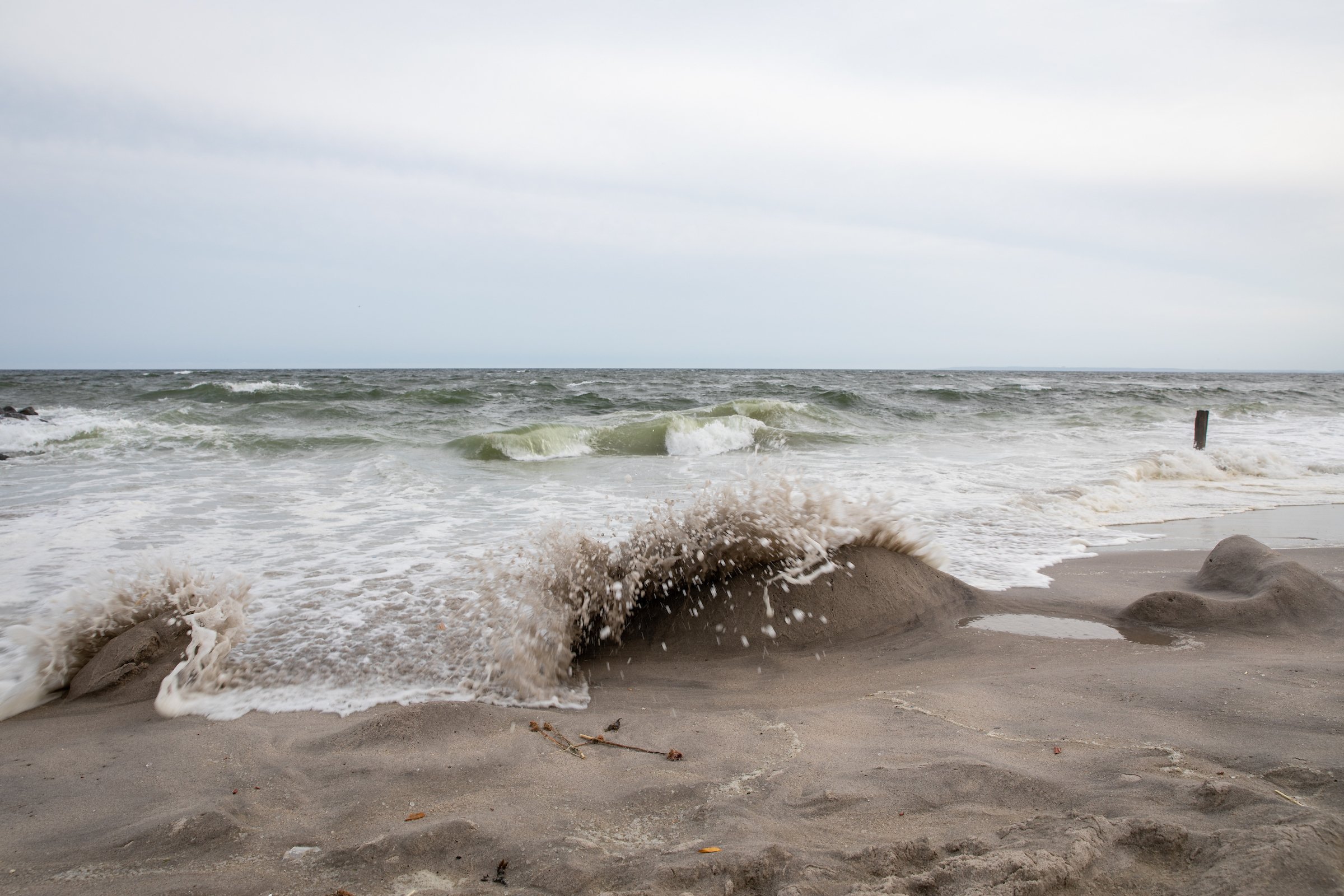 We say goodbye to the high tide, taking all of our natural found object sculptures away. Photo by Walter Wlodarczyk