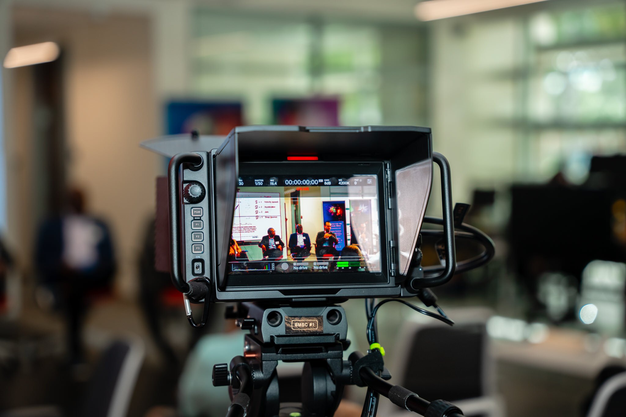 A camera set up to record a video at a corporate event