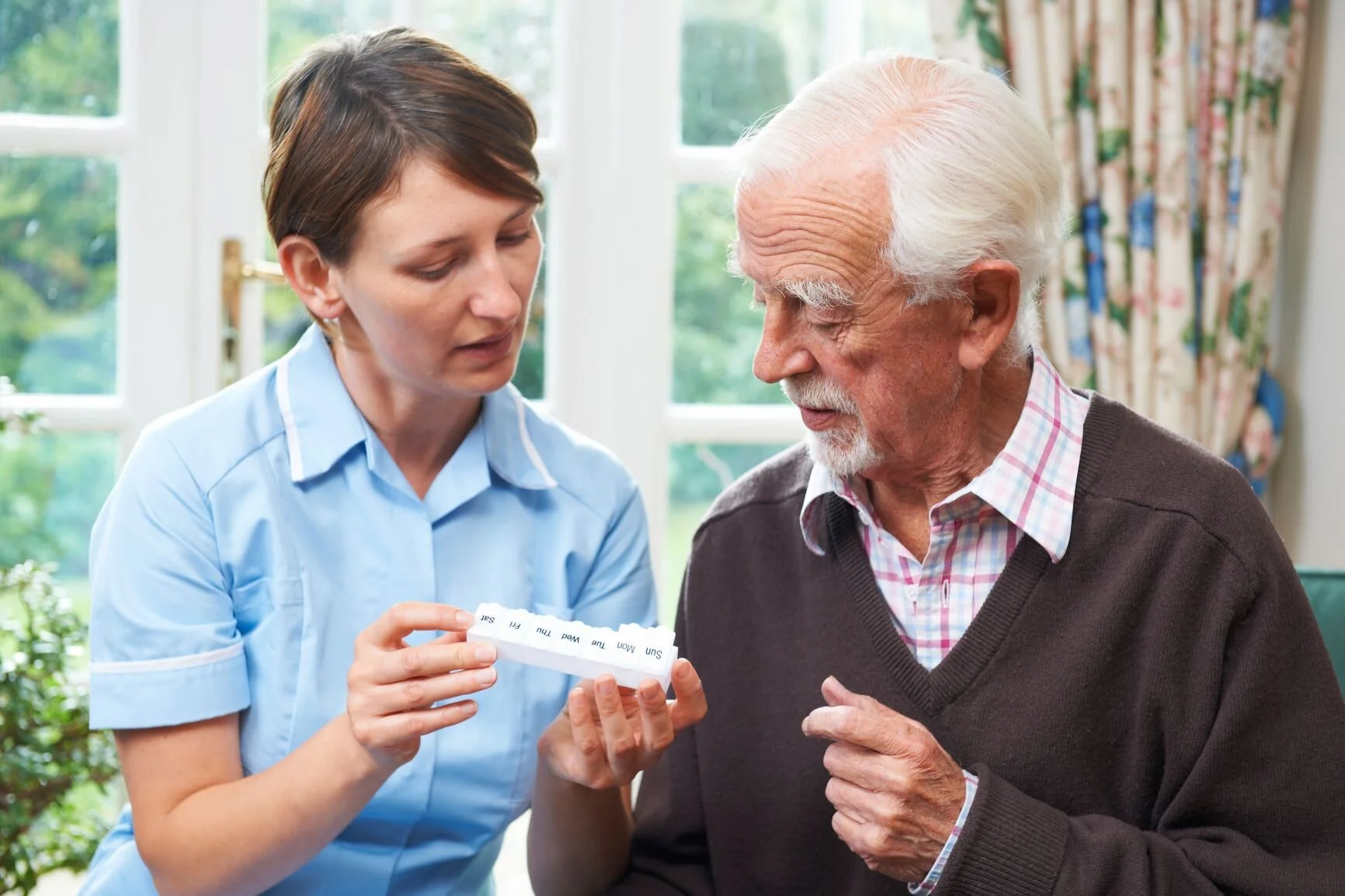 Assist with medications elderly gentleman.jpg