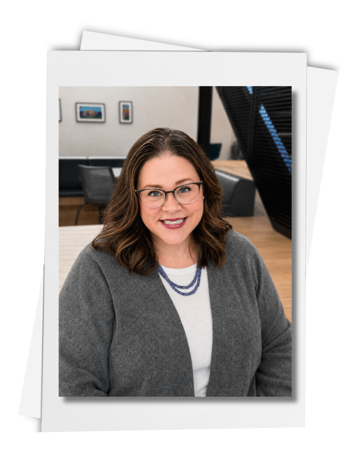 Photo of Dr. Sarah Porter placed on top of a stack of papers