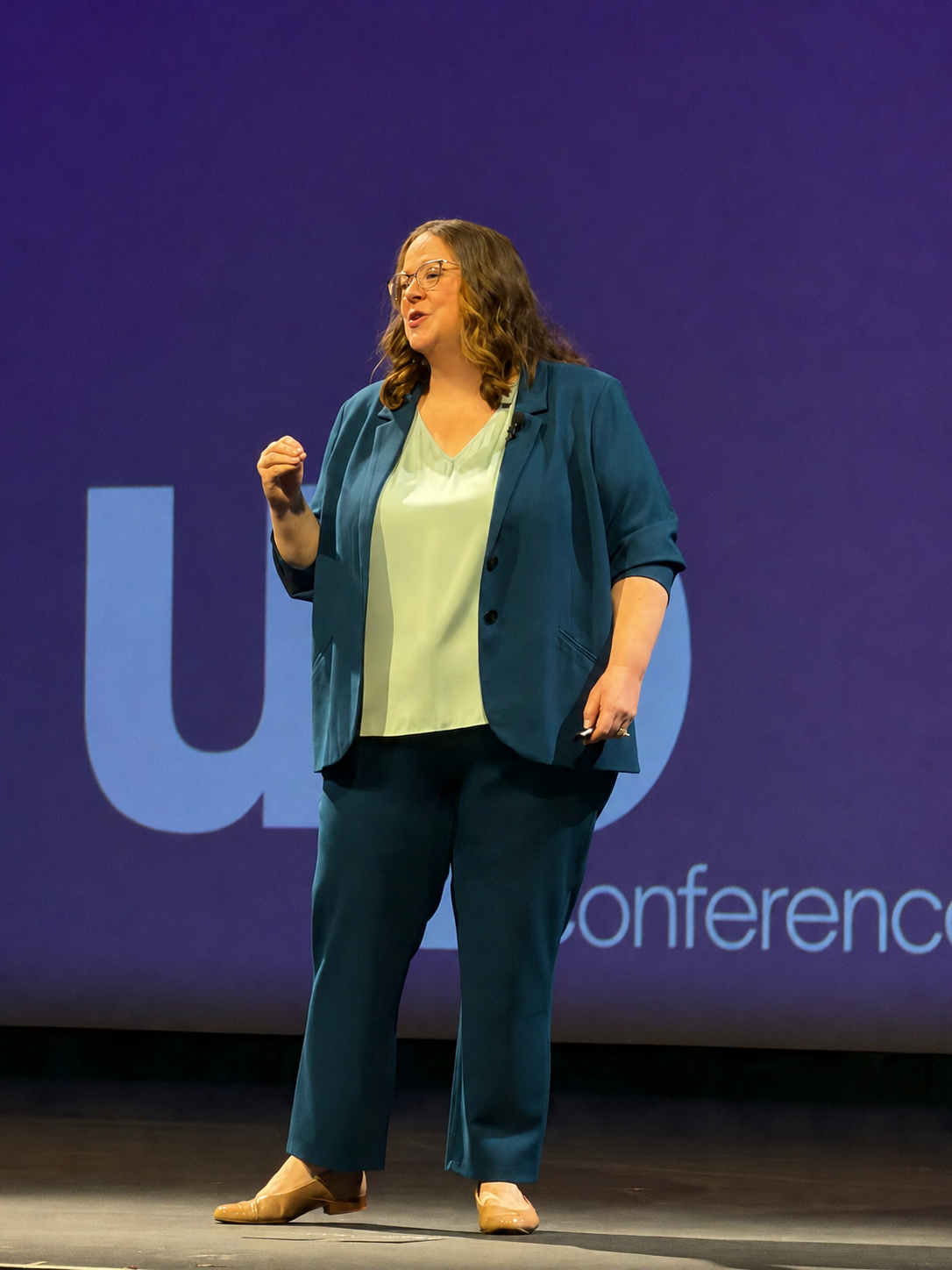 Sarah speaking from a stage