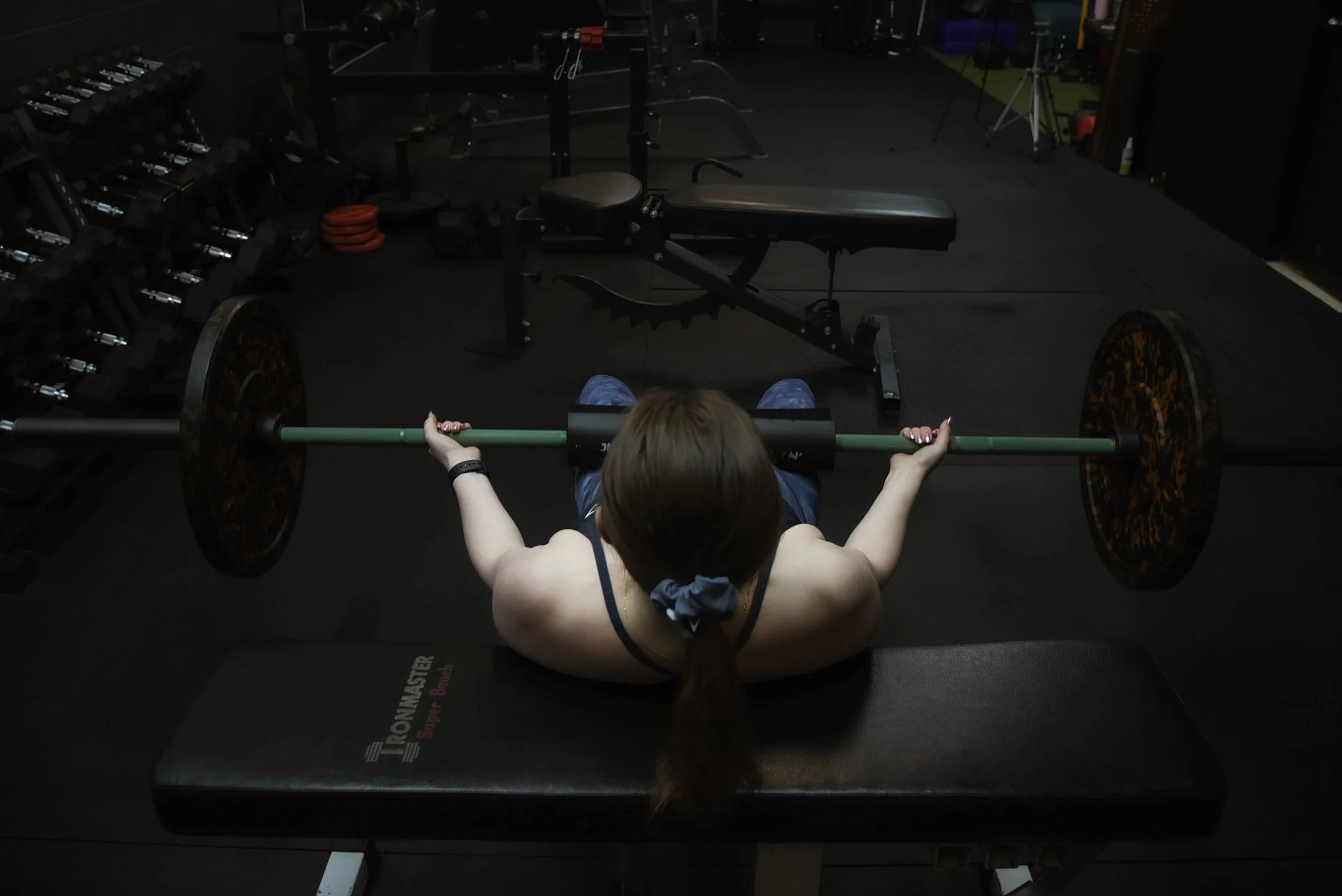 personal trainer lifting weights