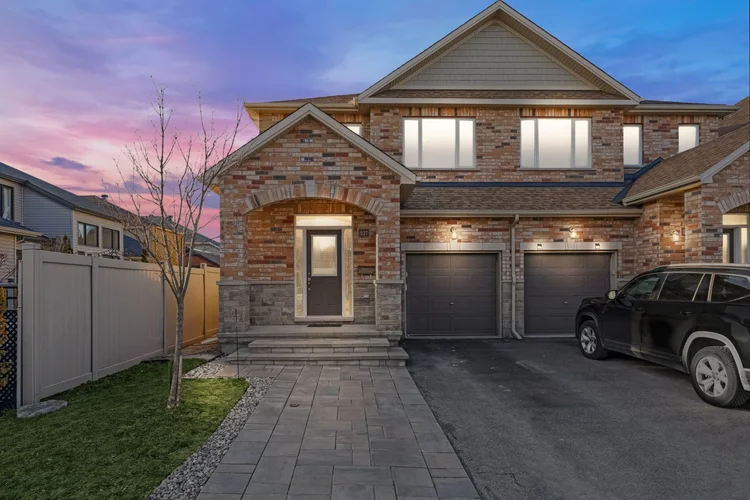 Brick home photographed at twilight photographed by NVISION 3D
