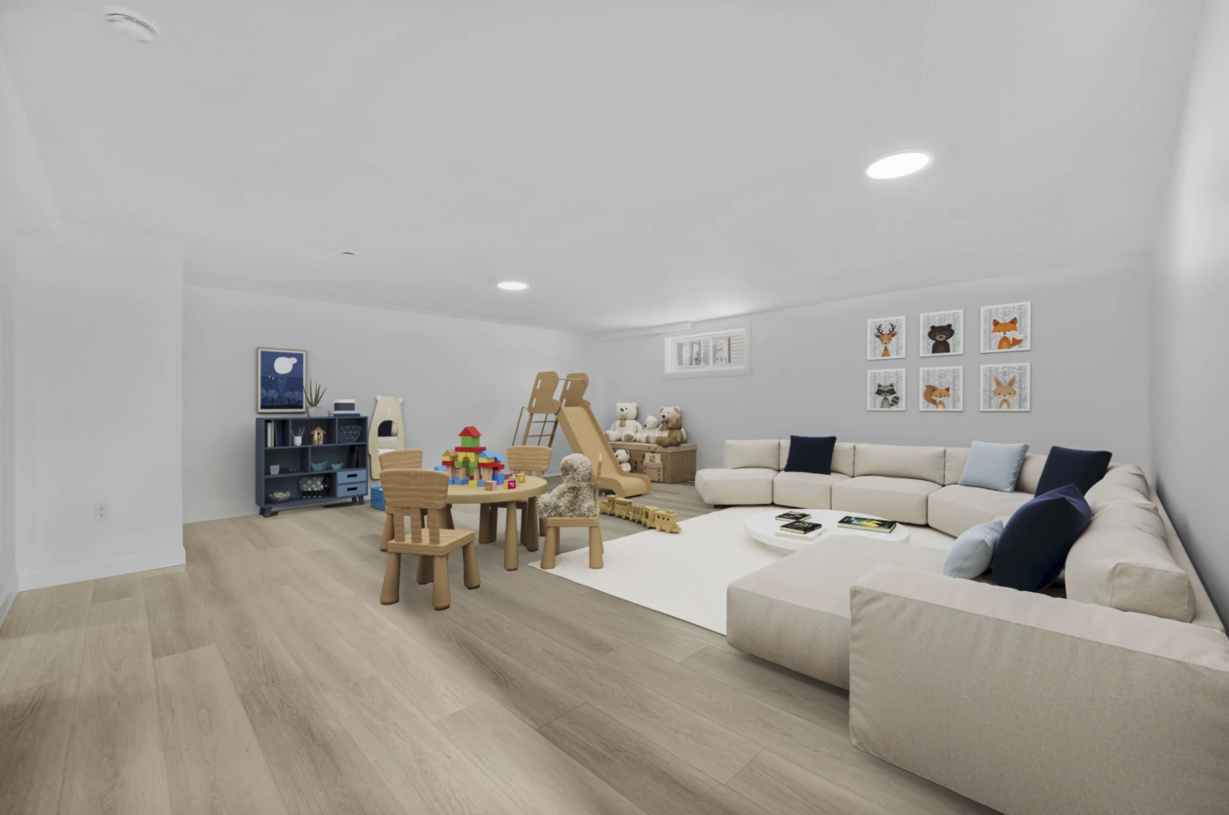 Kids' playroom with wooden table and chairs, toy slide, stuffed animals, building blocks, plush toys, framed animal art on the wall, white sectional sofa with navy and light blue pillows, small window, and light wood flooring.