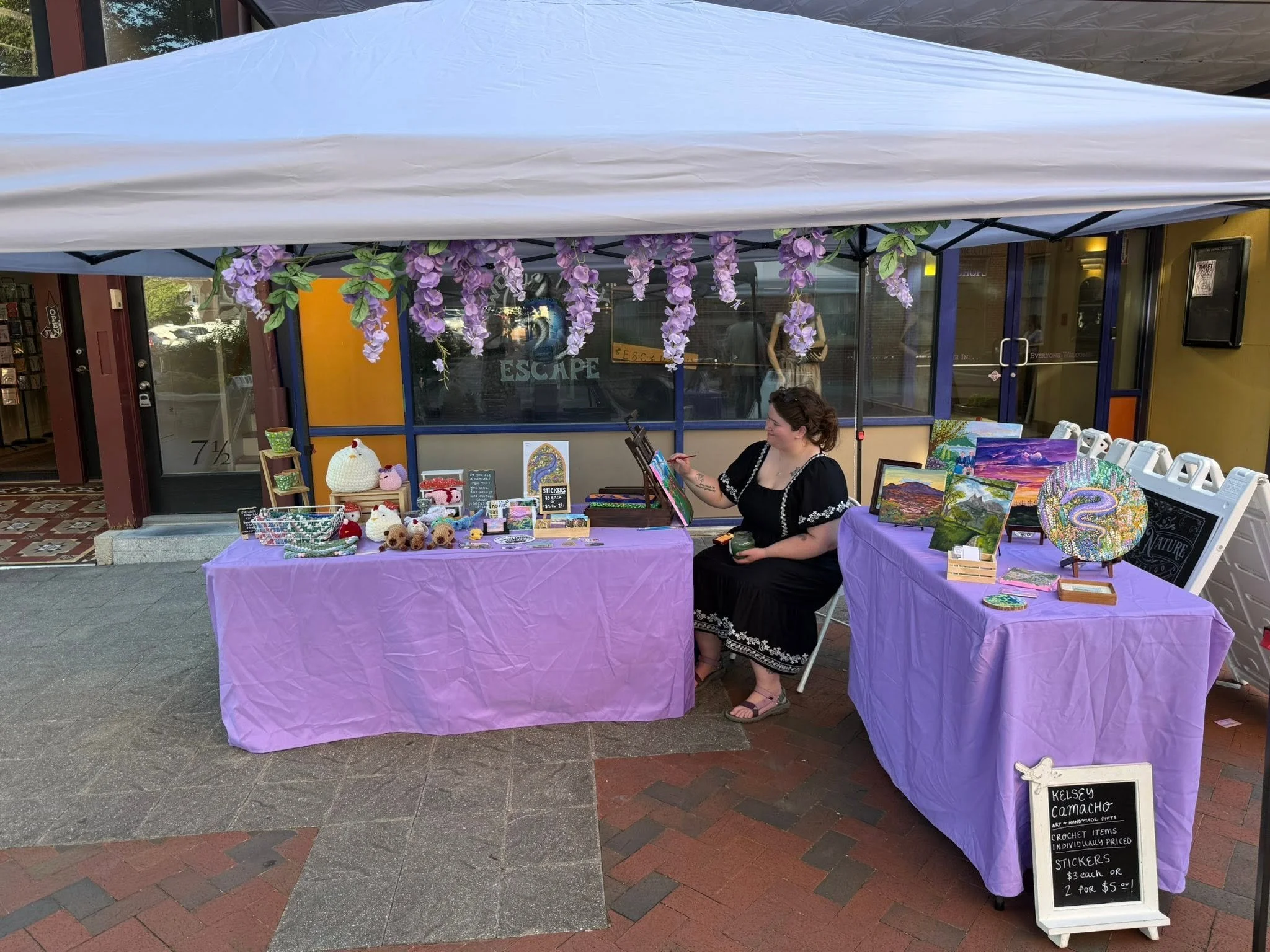 Me Painting at My Booth 6.5.26.jpg